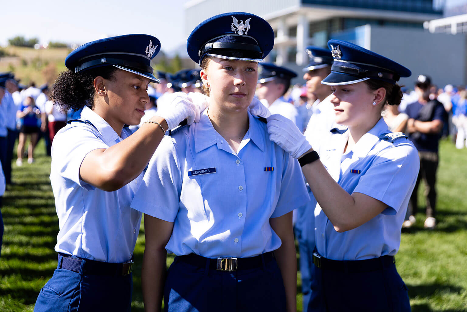 A fourth-class cadet receives shoulder boards during the Acceptance Day Parade at the U.S. Air Force Academy, Colo., Aug. 5, 2026. The presentation of fourth-class shoulder boards signifies the cadet's acceptance into the Cadet Wing following the successful completion of Basic Cadet Training. (U.S. Air Force photo by Ray Bahner)
