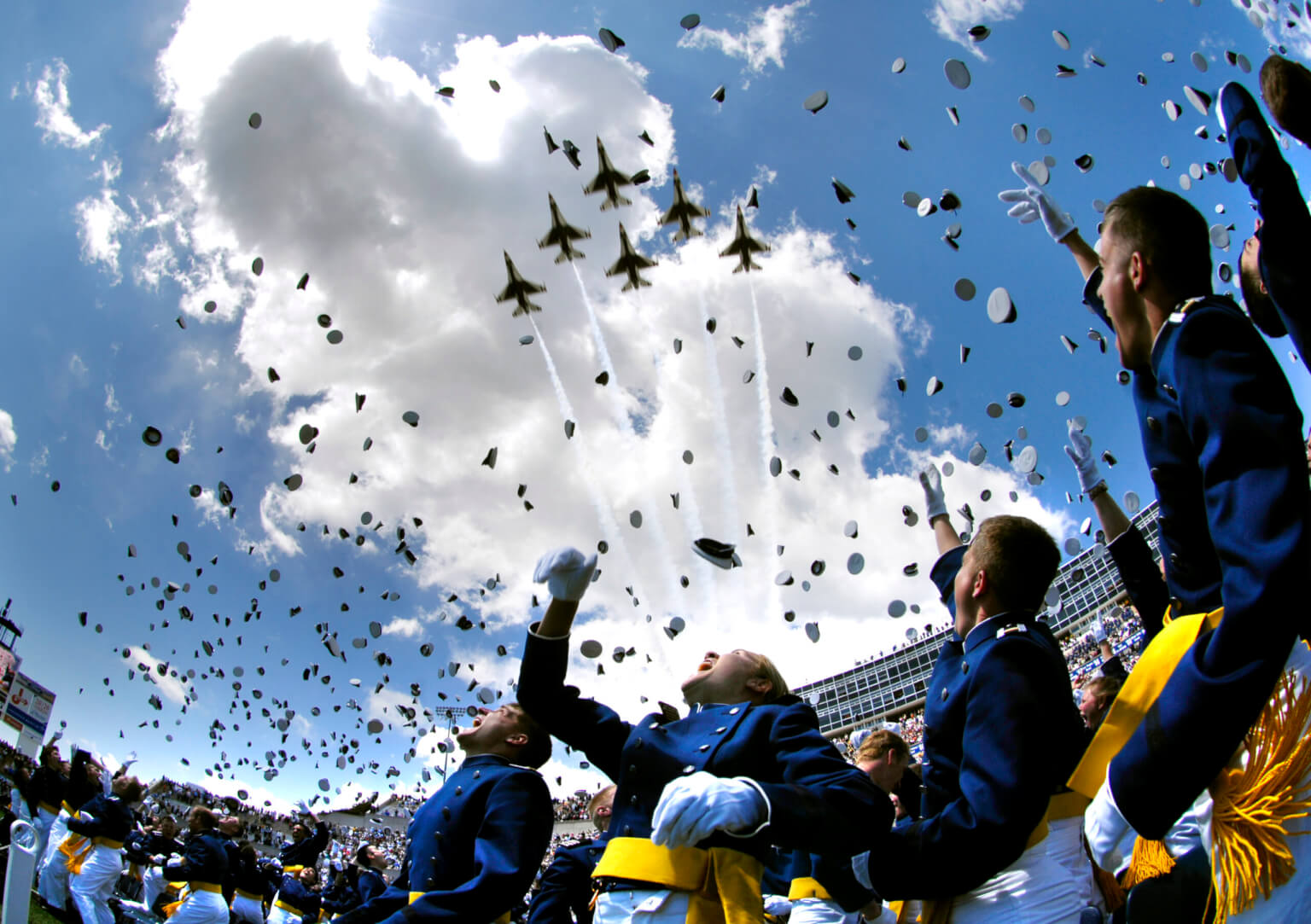 Cadets tossing hats in air at graduation