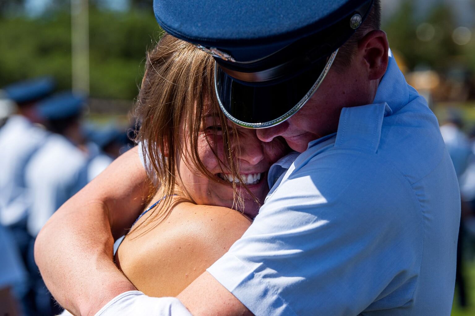 A cadet embraces a member of their family during Acceptance Day