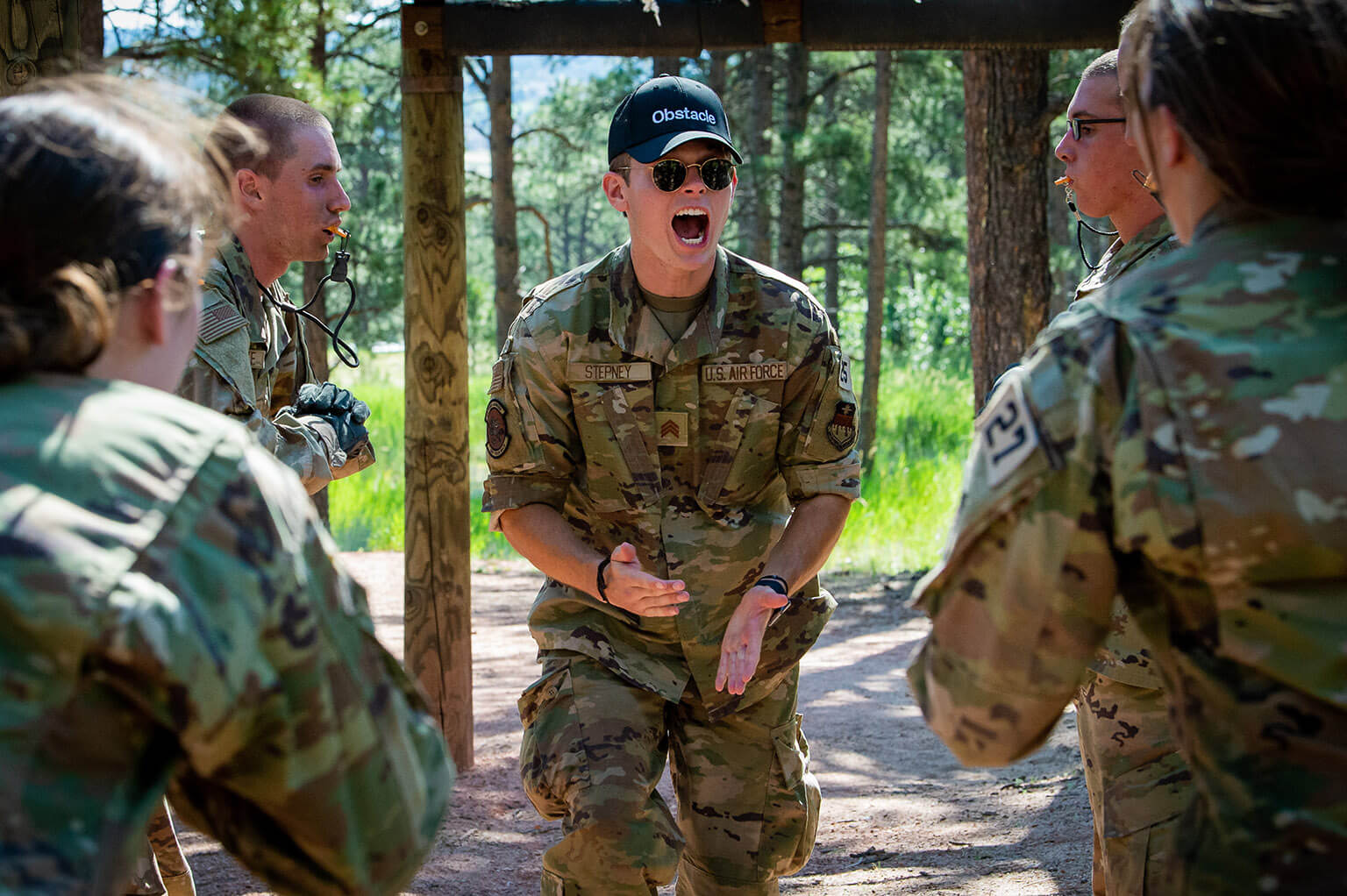 U.S. Air Force Academy Cadet 2nd Class Alexander Stepney corrects basic cadets during the obstacle course