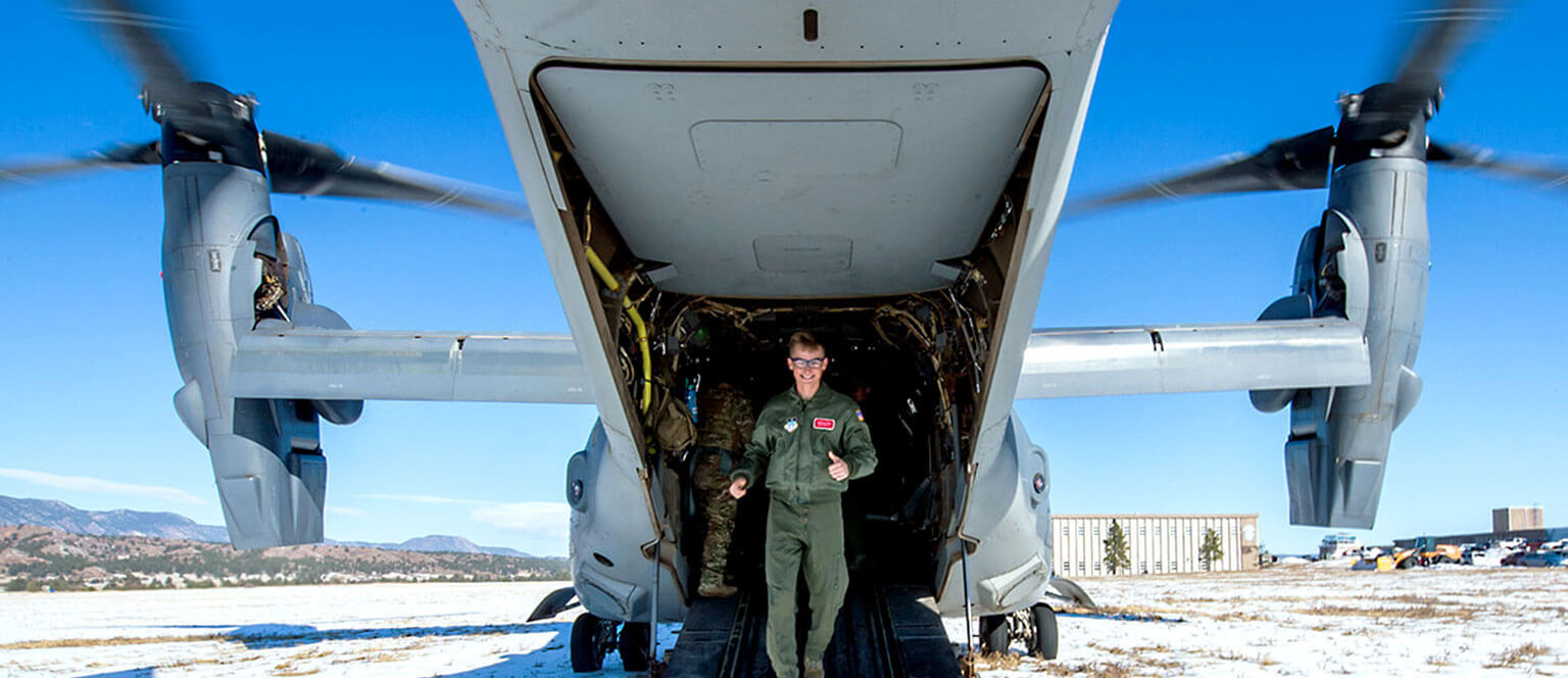 Air Force Academy cadet exiting the back of an Osprey