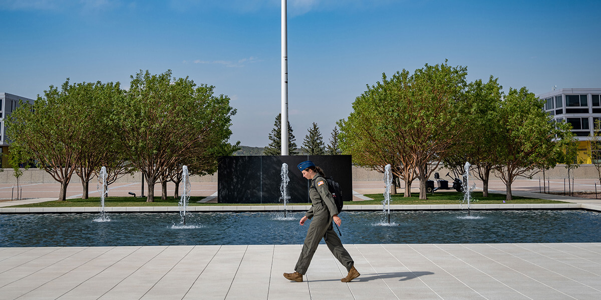 Cadet walking across the Terrazzo at the Academy