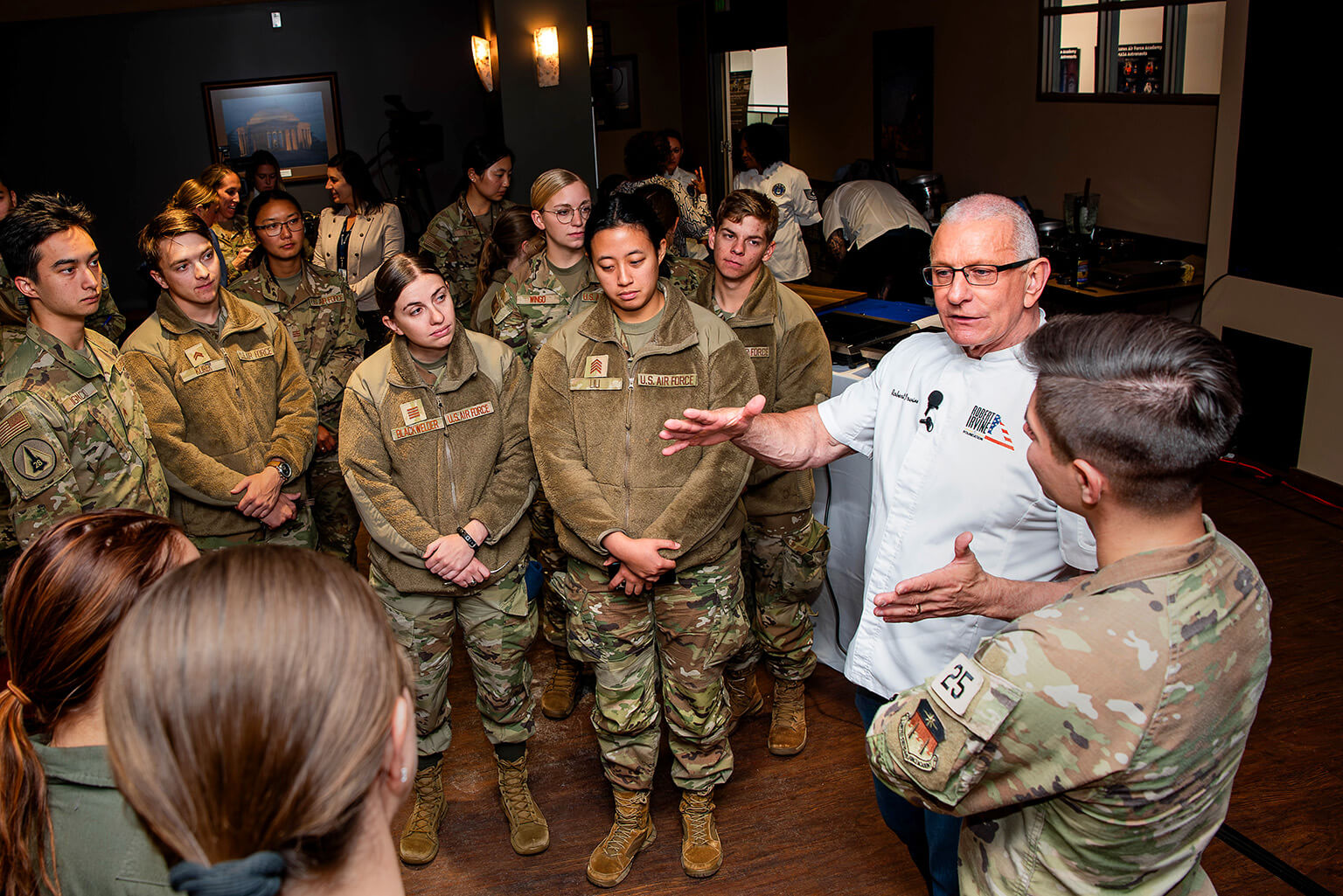 Celebrity chef Robert Irvine talks to U.S. Air Force Academy cadets during a cooking demonstration.