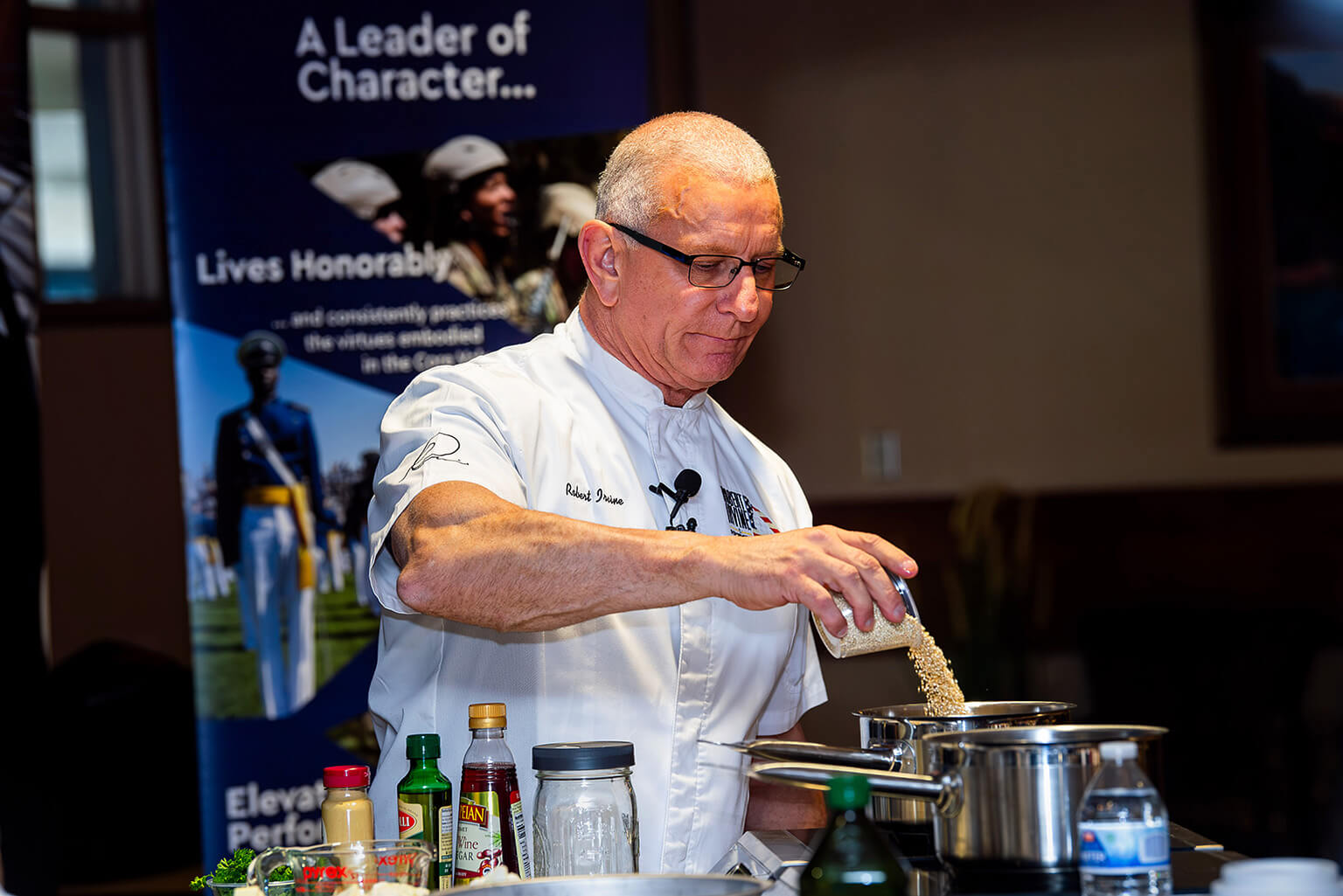 Celebrity chef Robert Irvine prepares a dish during a cooking demonstration.