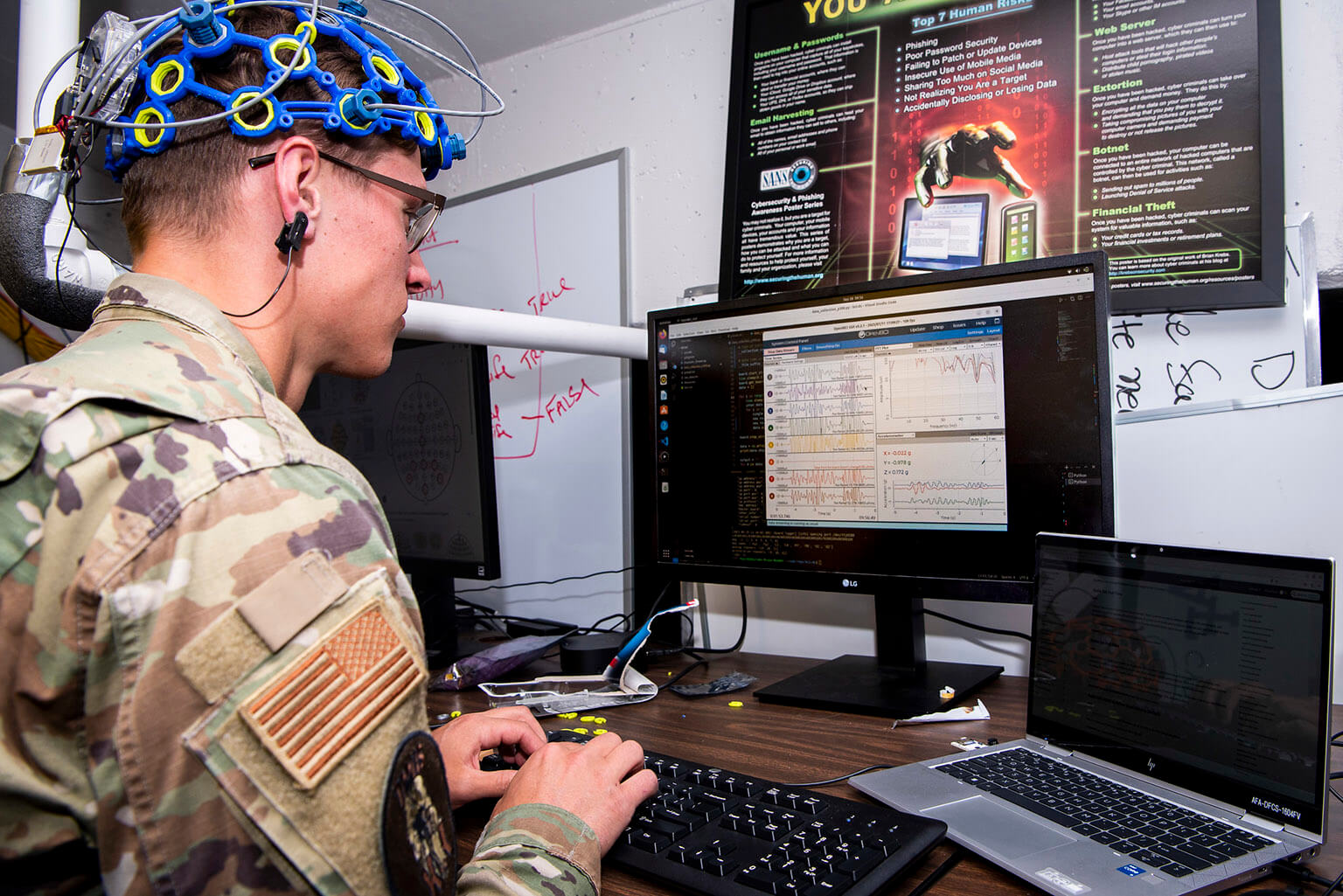 cadet with sensors on head working at computer