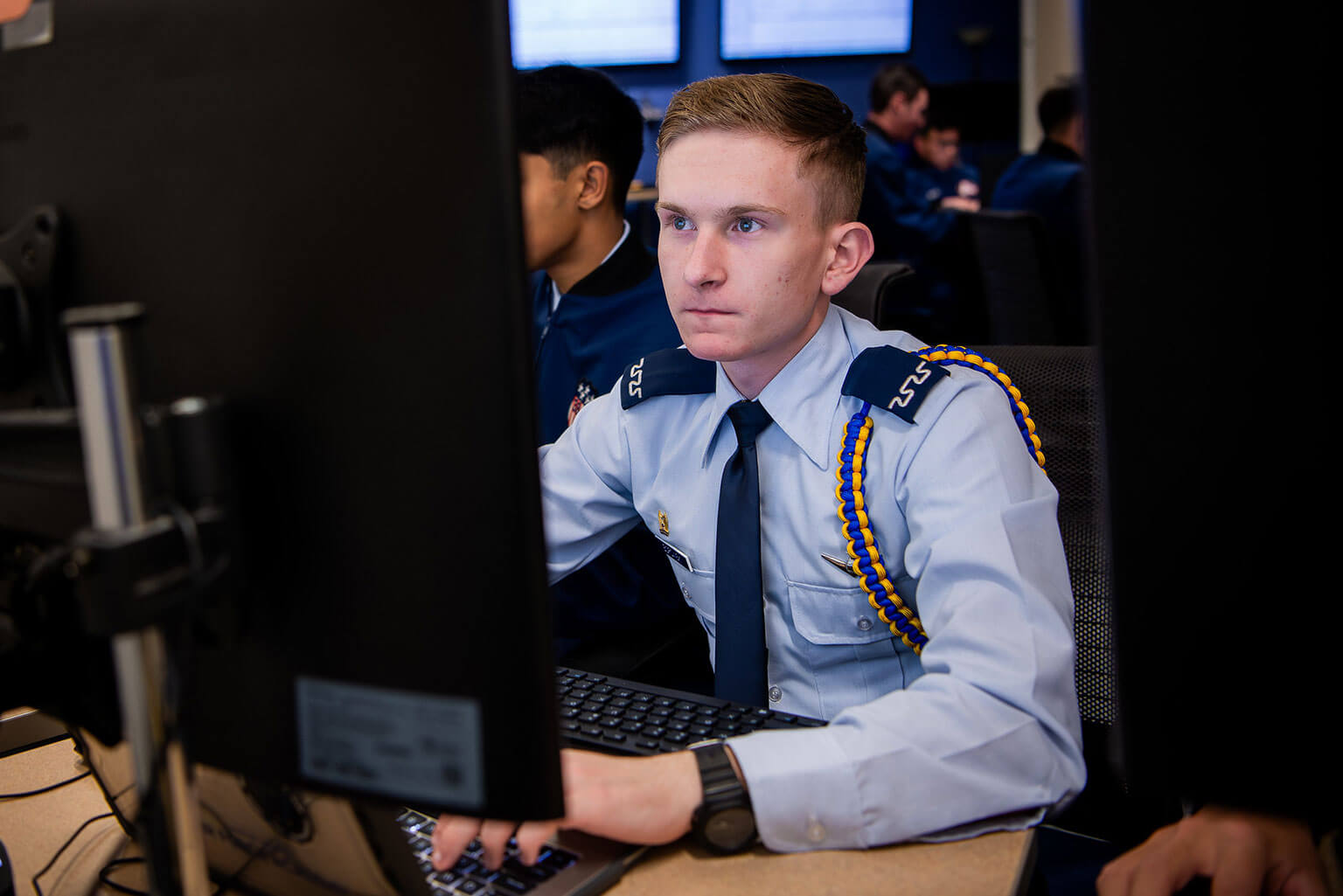 A cadet working through data during a cyber challenge.