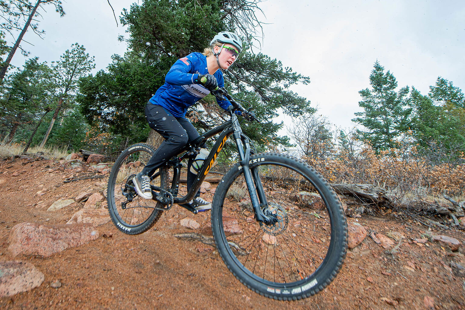 A member of the Cycling Club catches some air off of a jump.