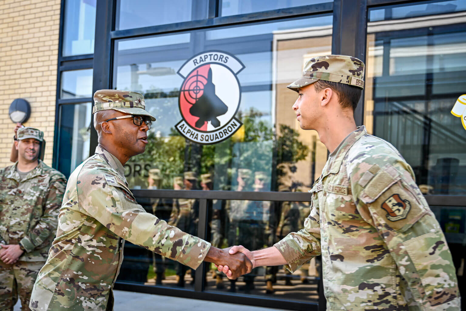 Brig. Gen. Gavin Marks, Commandant of Cadets, coins then-Cadet Candidate Roman Bereguta at the U.S. Air Force Academy Preparatory School, Colo., Sept. 3, 2025. Bereguta was selected as one of the Air Force’s 12 Outstanding Airmen of the Year for 2025 while completing his Prep School year. (U.S. Air Force photo by Cadet Candidate Madison Harte)