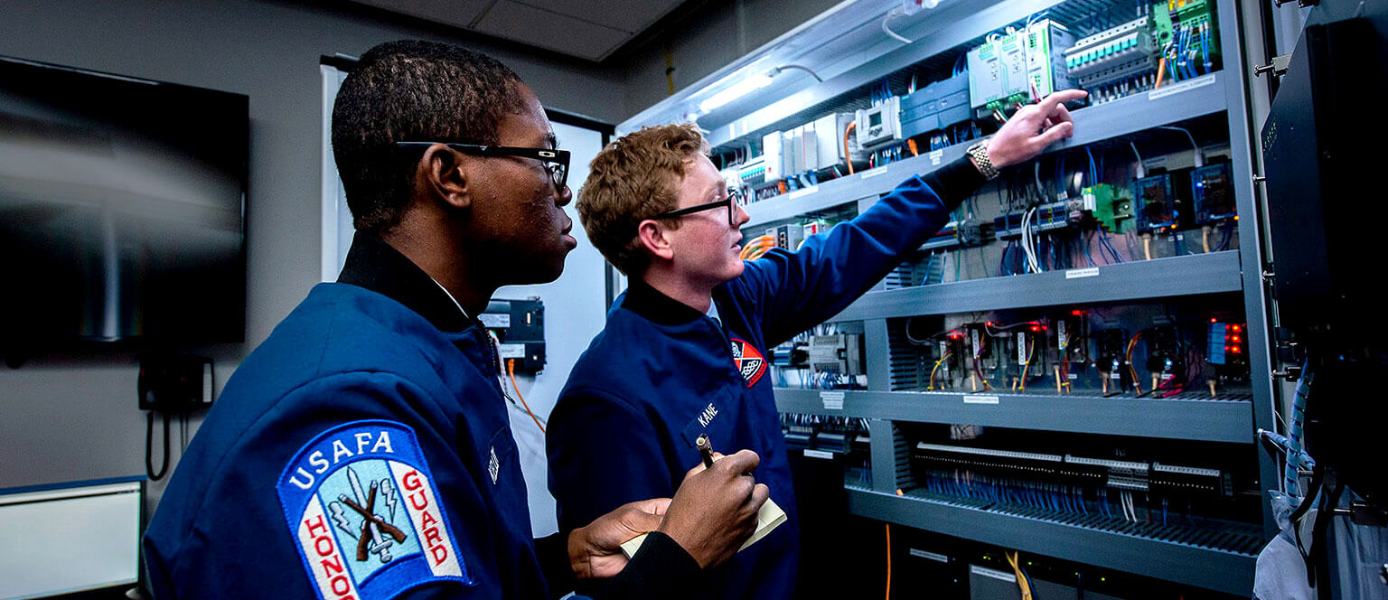 Cadets working on server rack