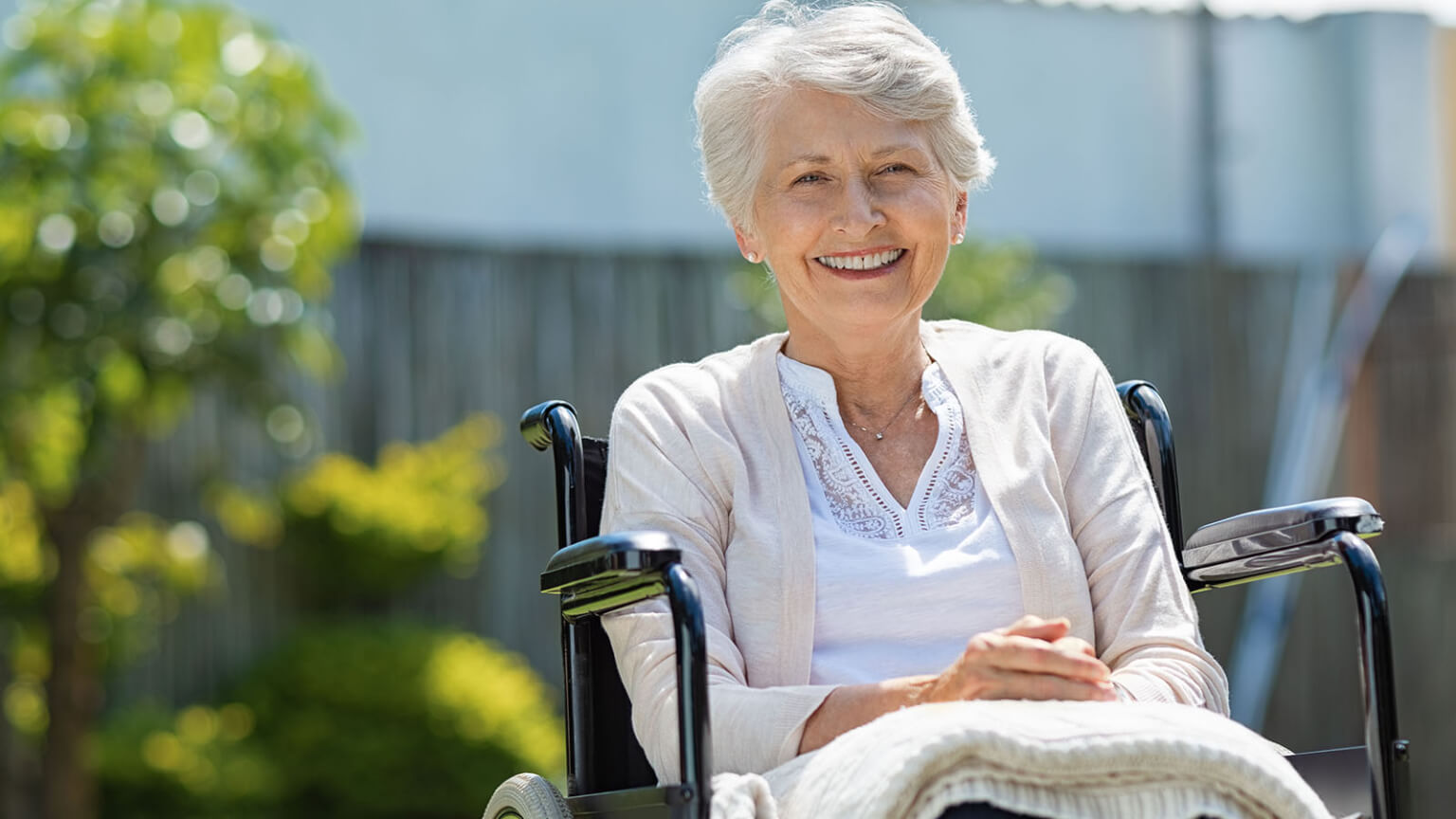 An elderly woman in a wheelchair.