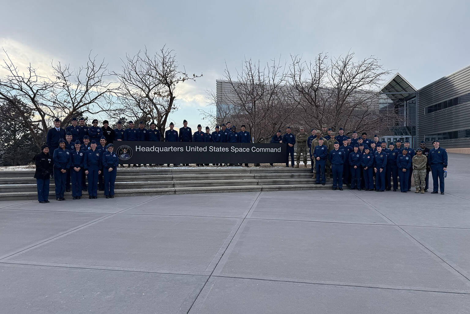 More than 70 cadets pose for a photo outside Headquarters U.S. Space Command at Peterson Space Force Base, Colorado.