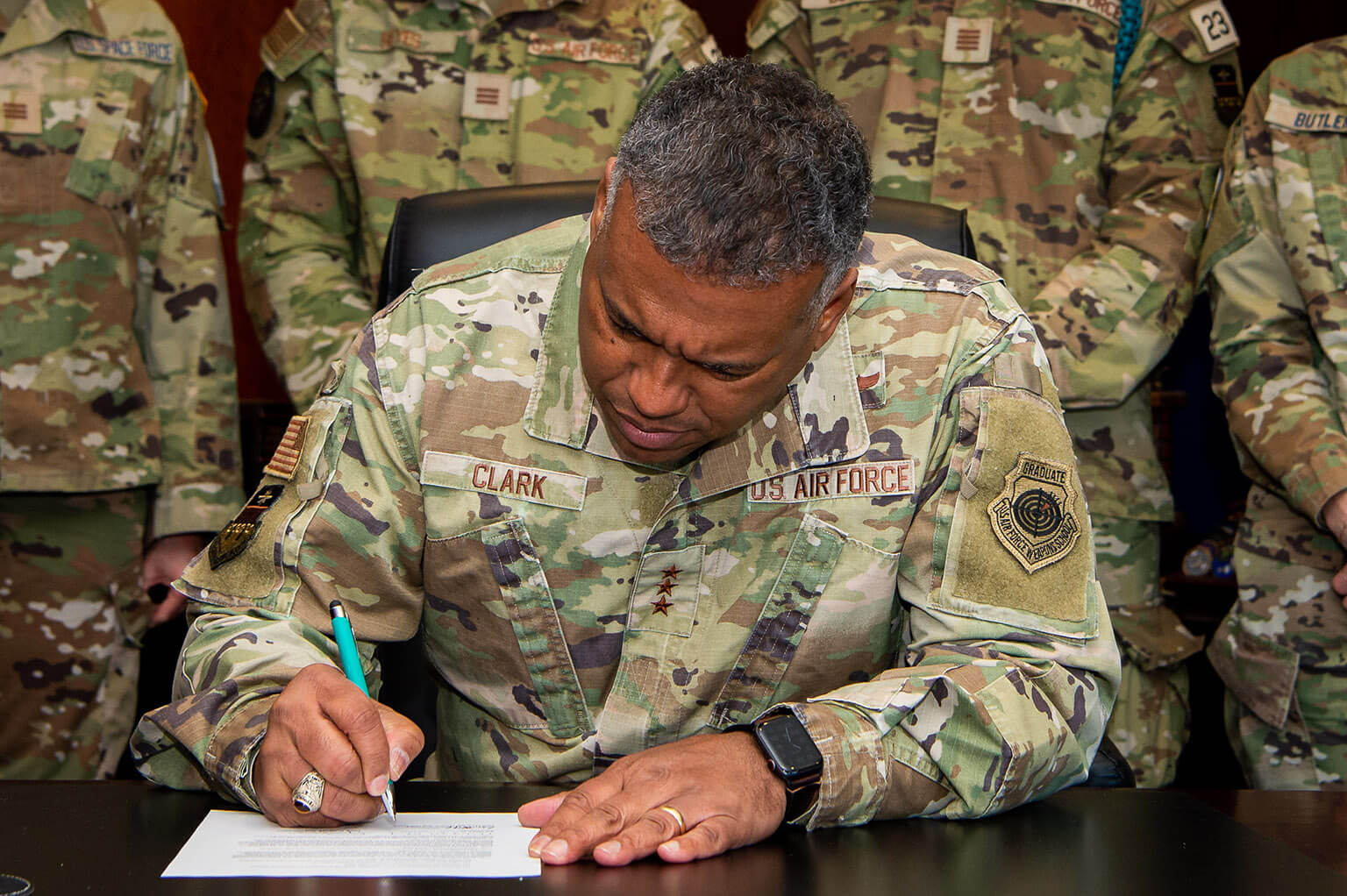 Lt. Gen. Richard Clark, U.S. Air Force Academy superintendent, signs the Encouraged to Report policy memo