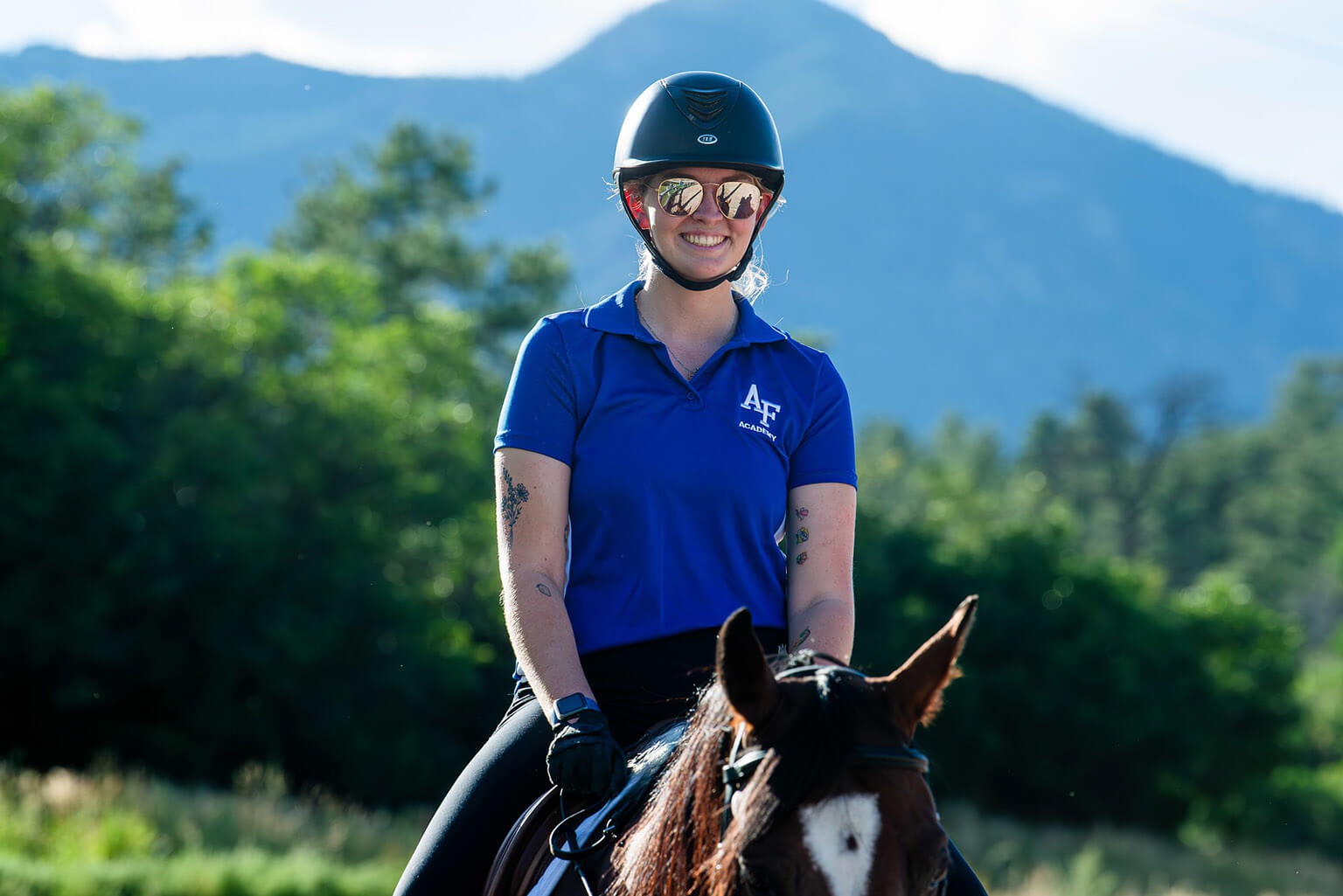 cadet riding on horse.