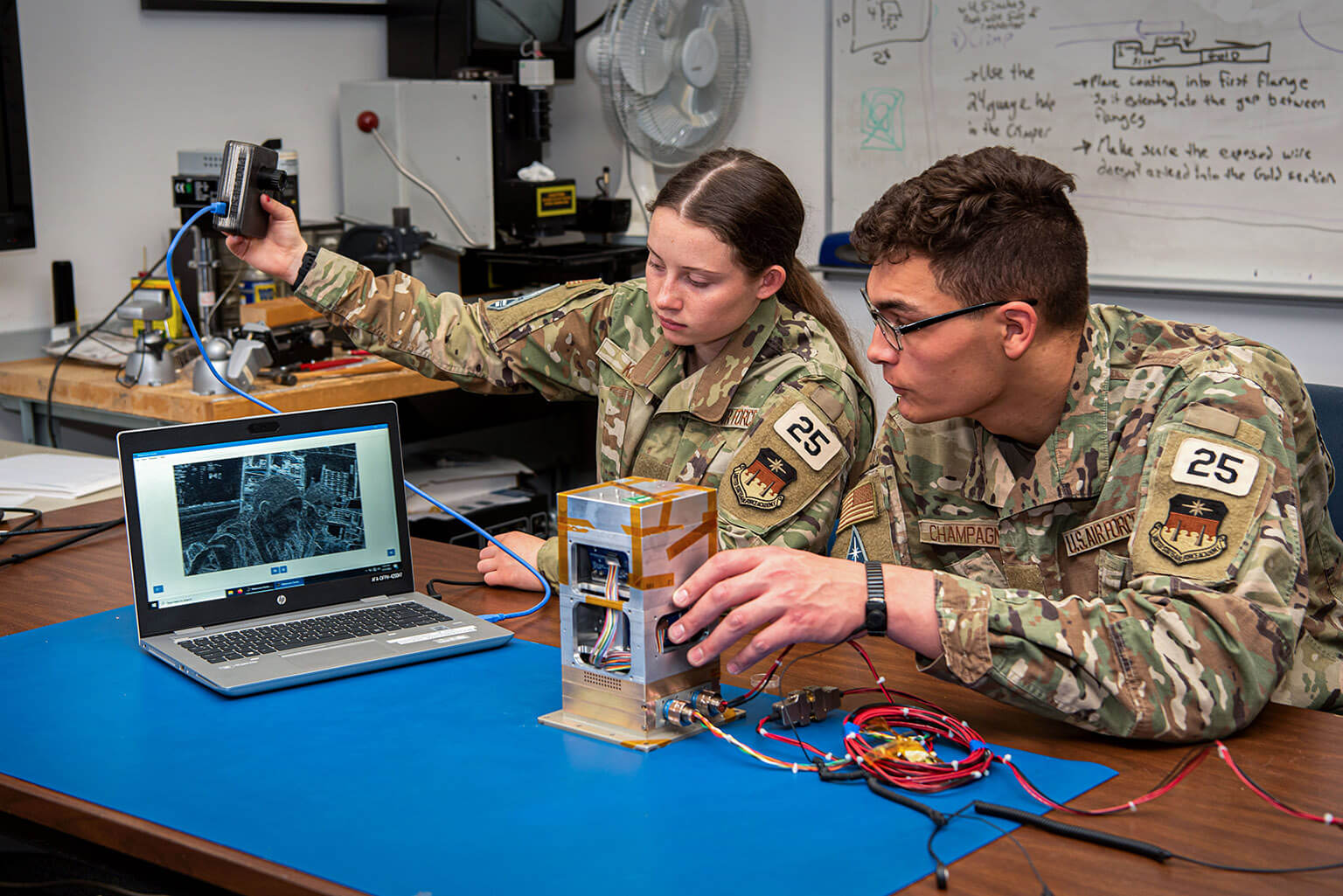 Cadets King and Champagne analyze the Falcon Neuro engineering unit on March 31, 2022