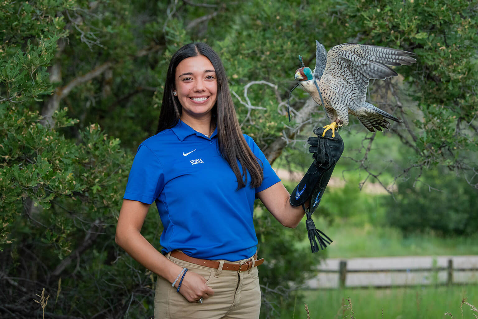 U.S. Air Force Academy Cadet 1st Class Elena Castañeda, falconry cadet-in-charge, displays Kuzco, one of the Academy’s 11 falcons