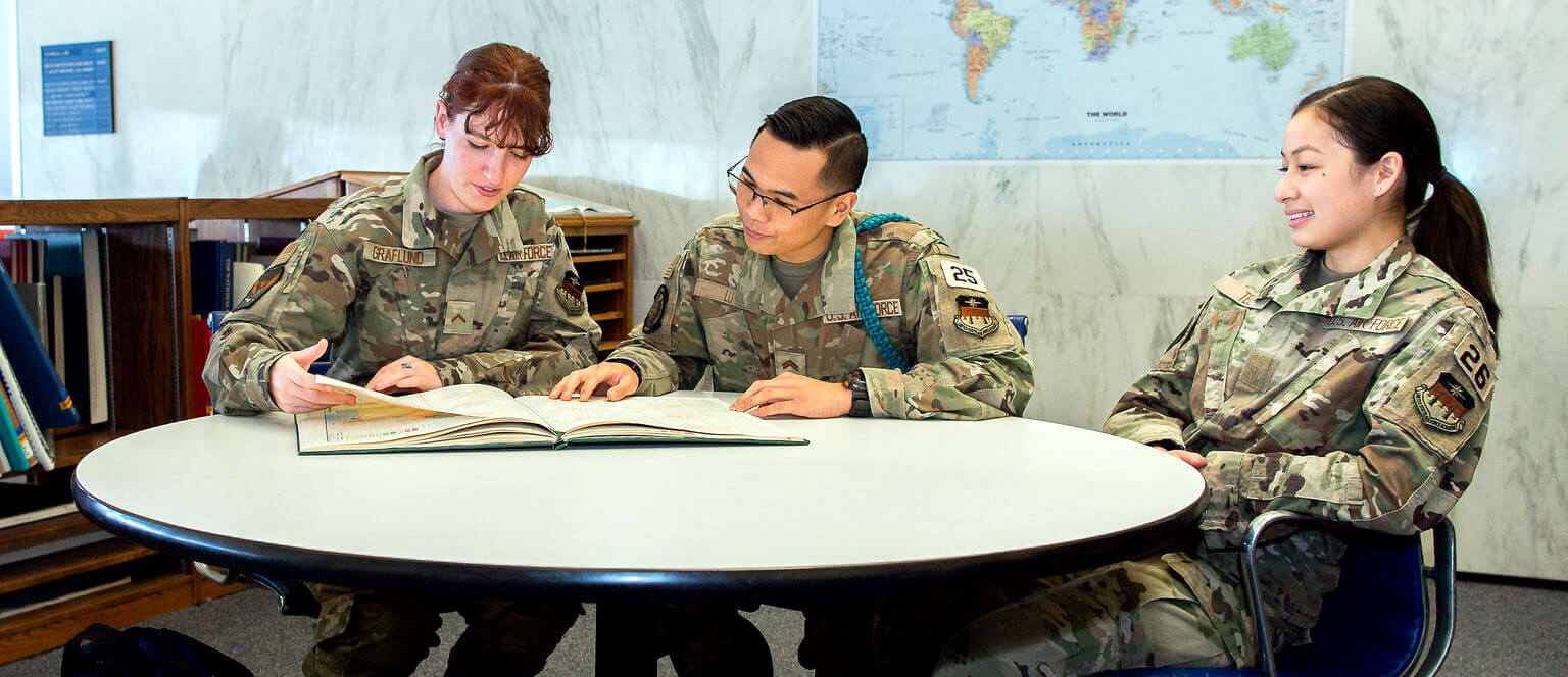 Cadets at table with map in background