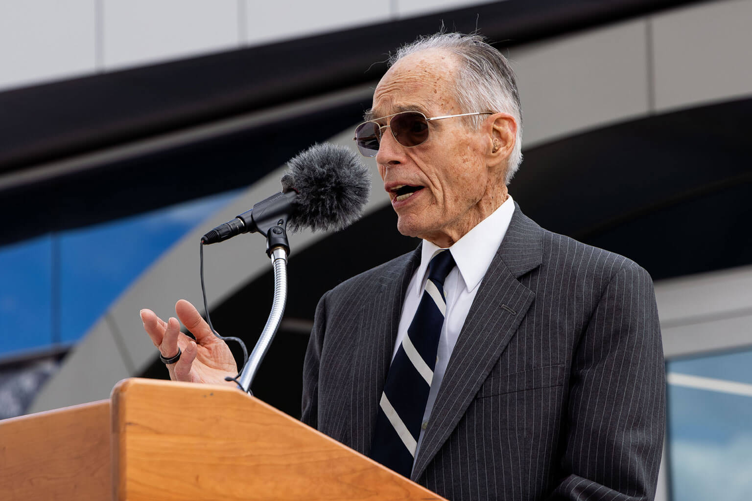 Lt. Gen. (Ret.) Bradley Hosmer speaks about his pride in seeing current cadets continue the Long Blue Line established by the Class of 1959 during the Hosmer Visitor Center ribbon-cutting ceremony on May 15, 2026, at the U.S. Air Force Academy. The remarks reflected on the connection between past and present Academy classes. (U.S. Air Force Photo by Trevor Cokley)