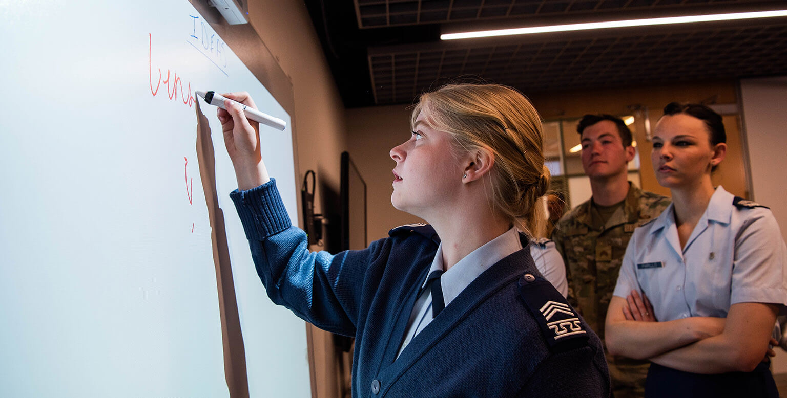 Cadet writing on whiteboard