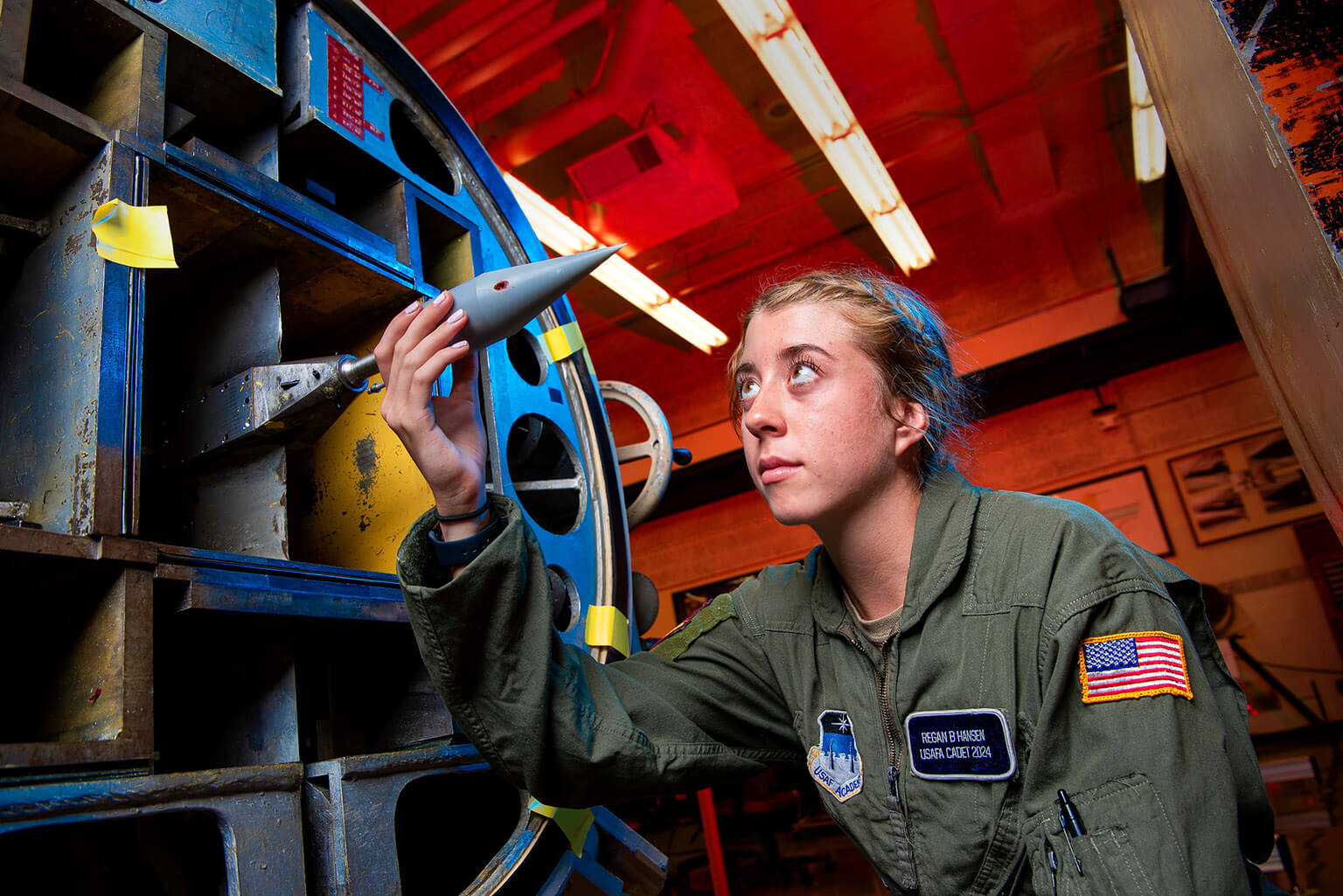 Cadet inspecting control jet interaction model nose cone