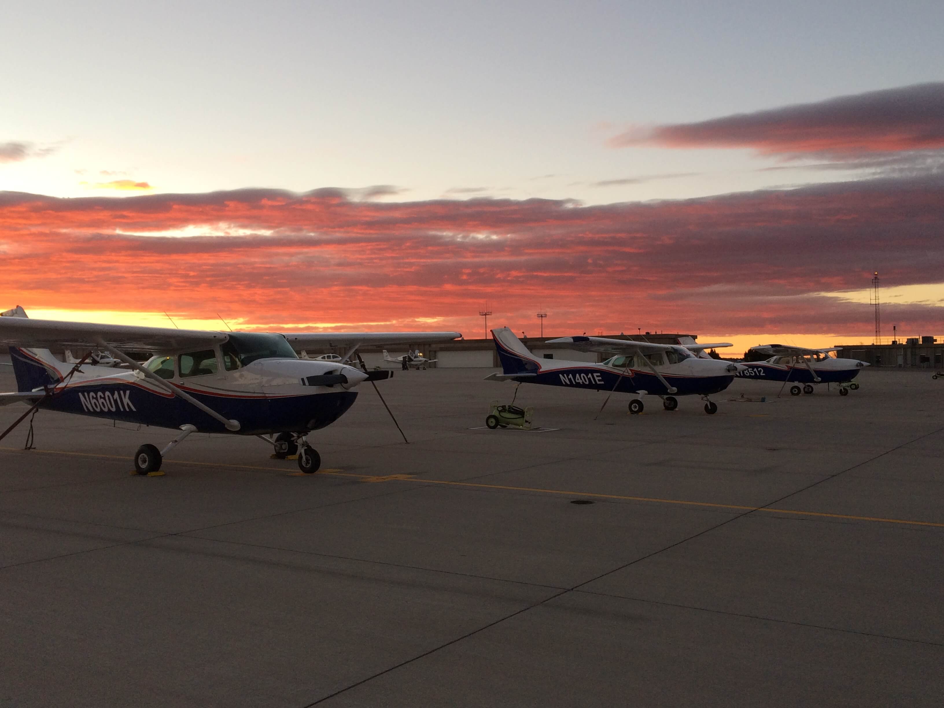 planes parked at airport Flight Training Center