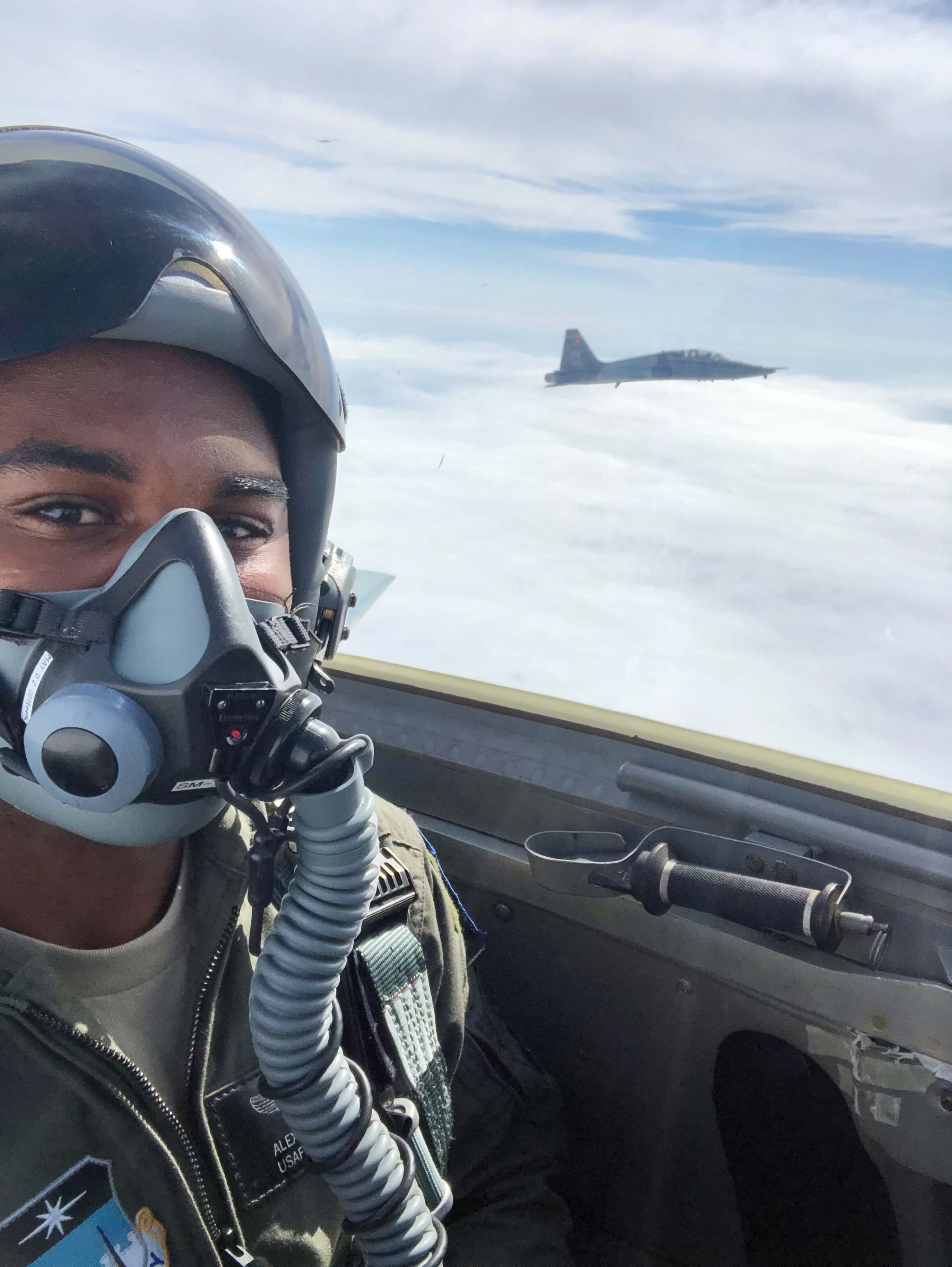 Photo of cadet flying plane wearing oxygen mask 