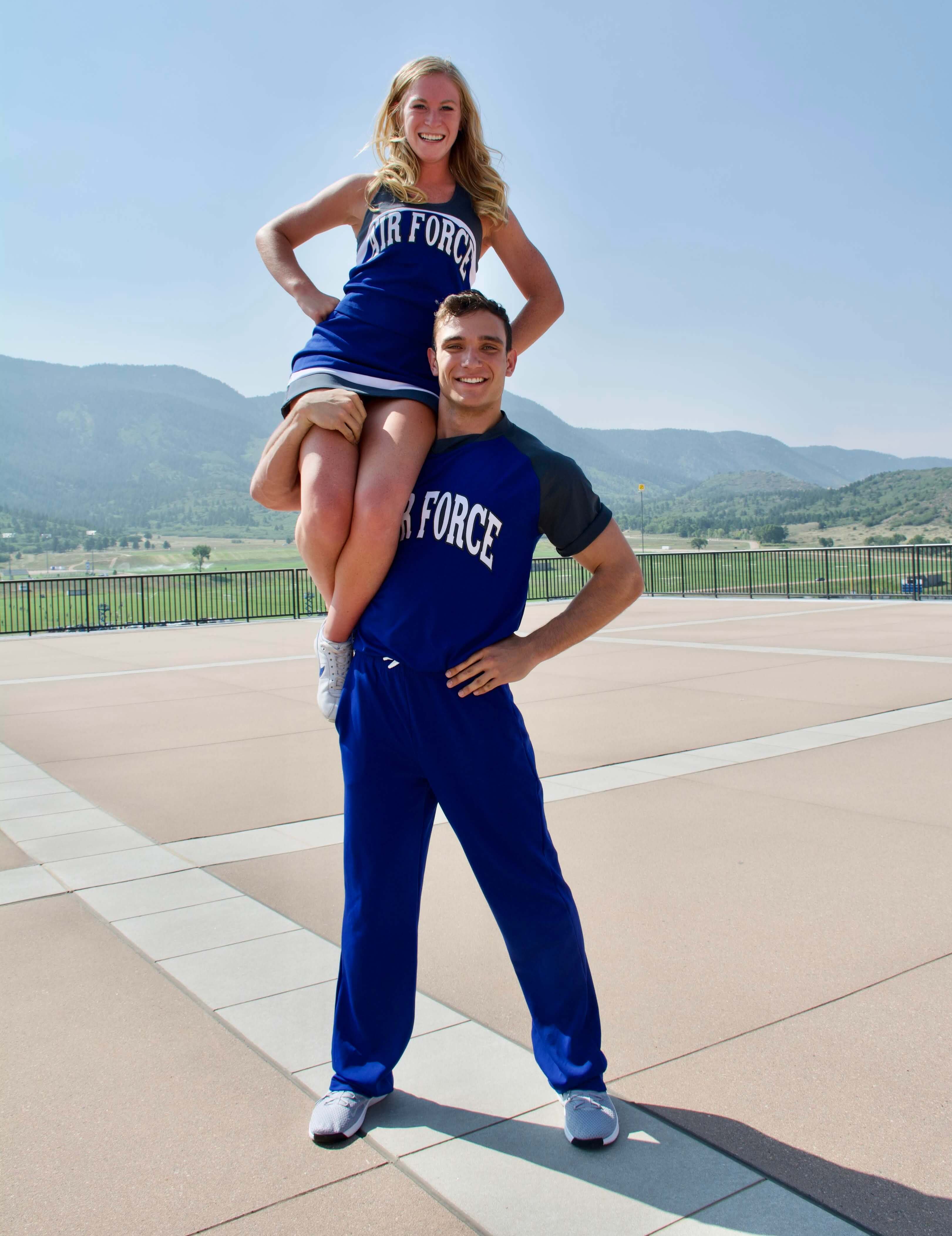 Thomas Chandler with a cheerleader on his shoulder
