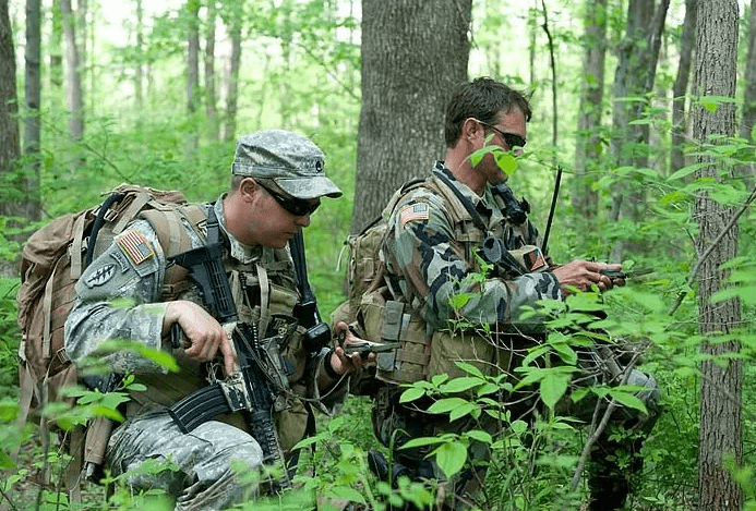 military personnel in woods