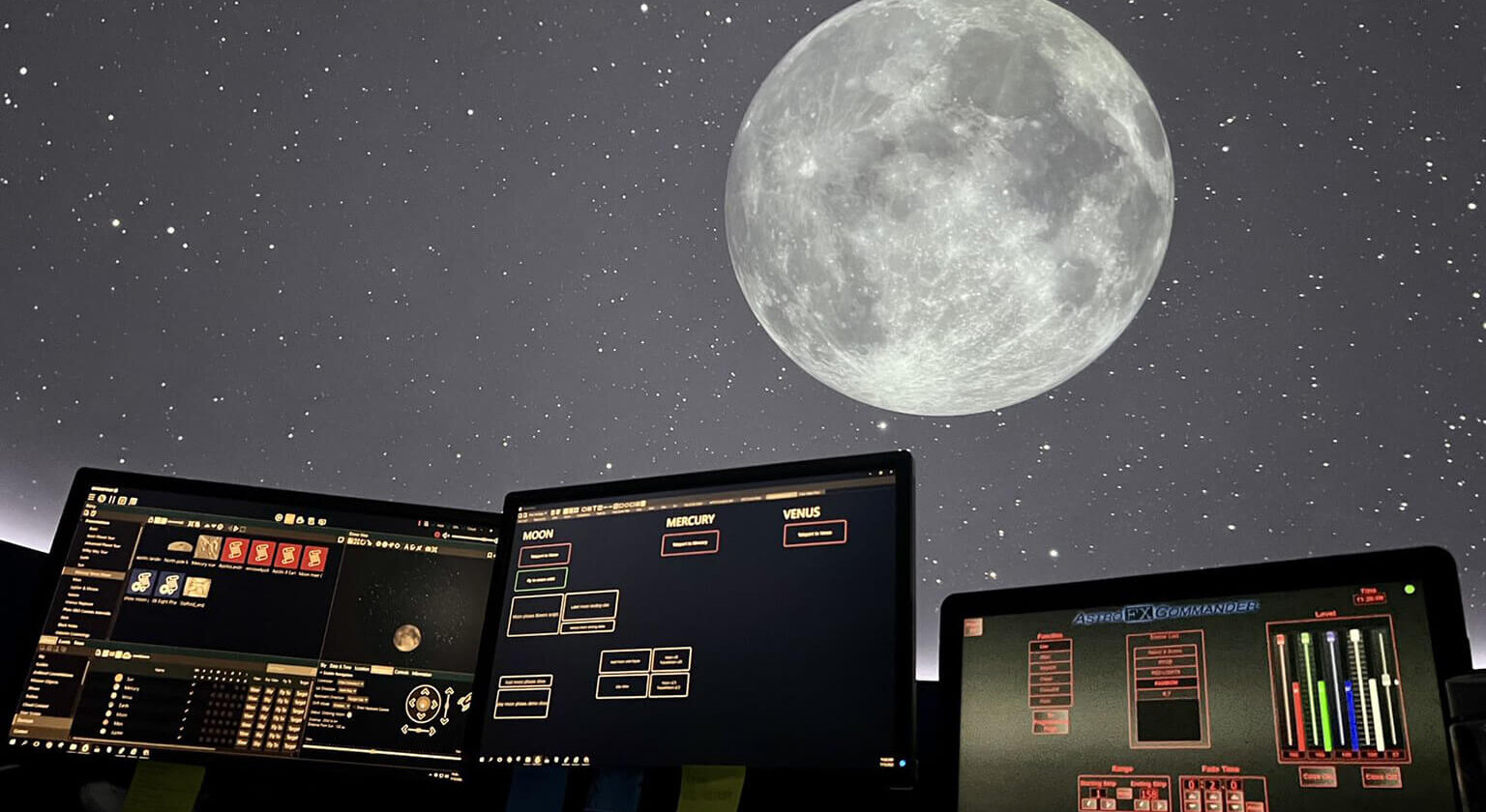 space exploration monitors illustrated through moon image at the Planetarium 
