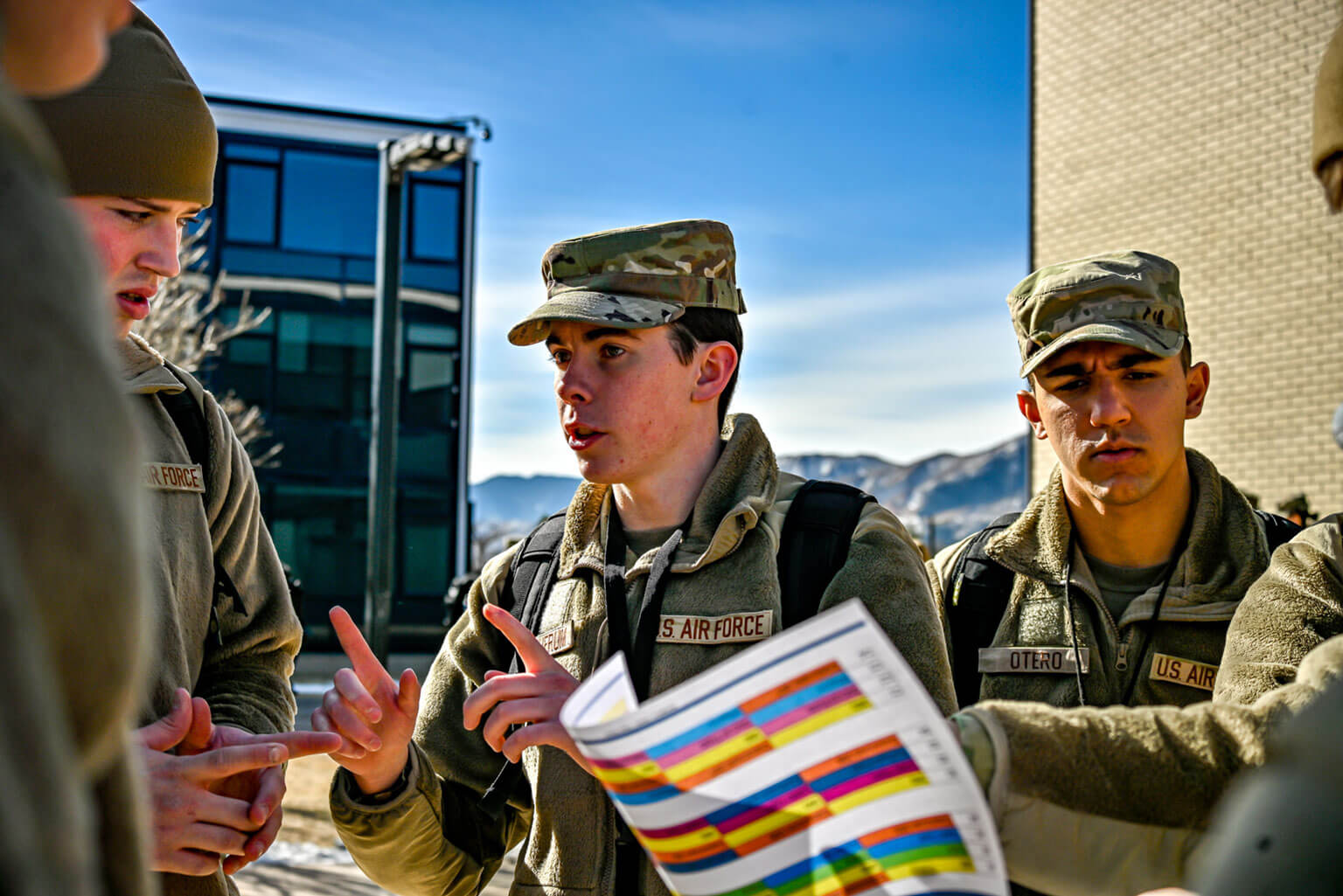 From left, cadet candidates Emerson Gatherum, Kellen LeCronier, and Alejandro Otero discuss the day’s gameplan during a Silver Saturday training exercise, at the U.S. Air Force Academy Preparatory School, Colorado, Jan. 31, 2026. The land navigation training exercise refined strategy and tightened execution before the training day kicked off. (U.S. Air Force Photo by C/C Madison Harte)