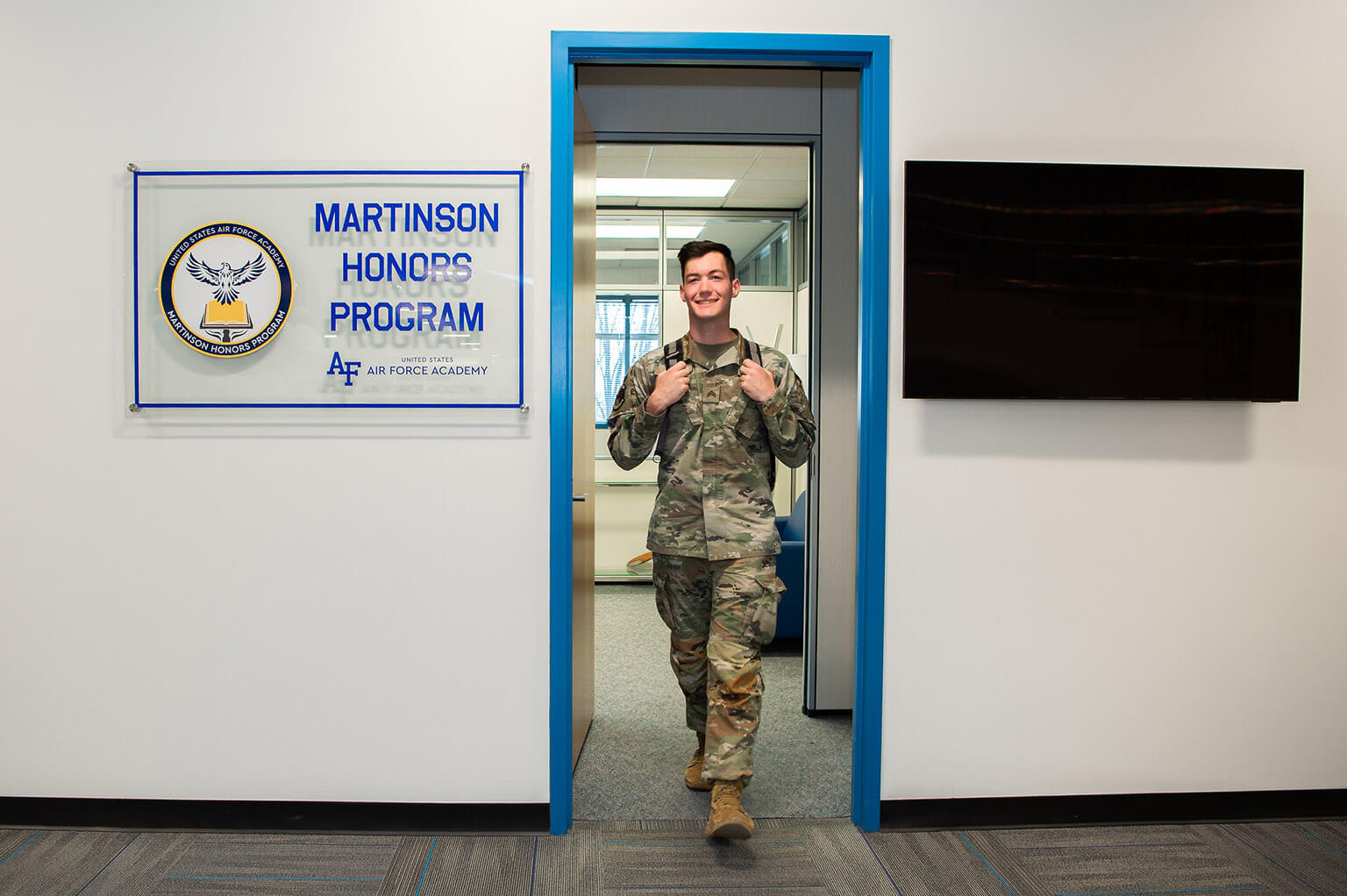 Cadet walking out of Martinson Honors Program office