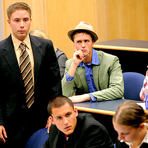 Image of cadets taking part in a mock trial during a competition.