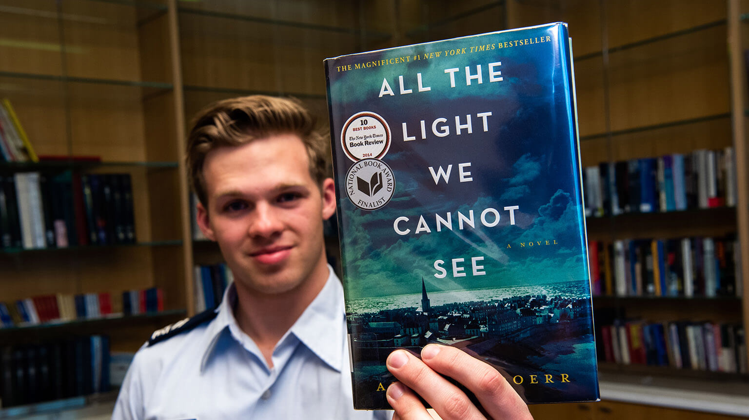 Cadet holding book