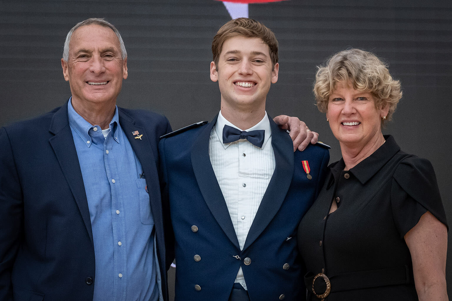 Parents with cadet in dress uniform