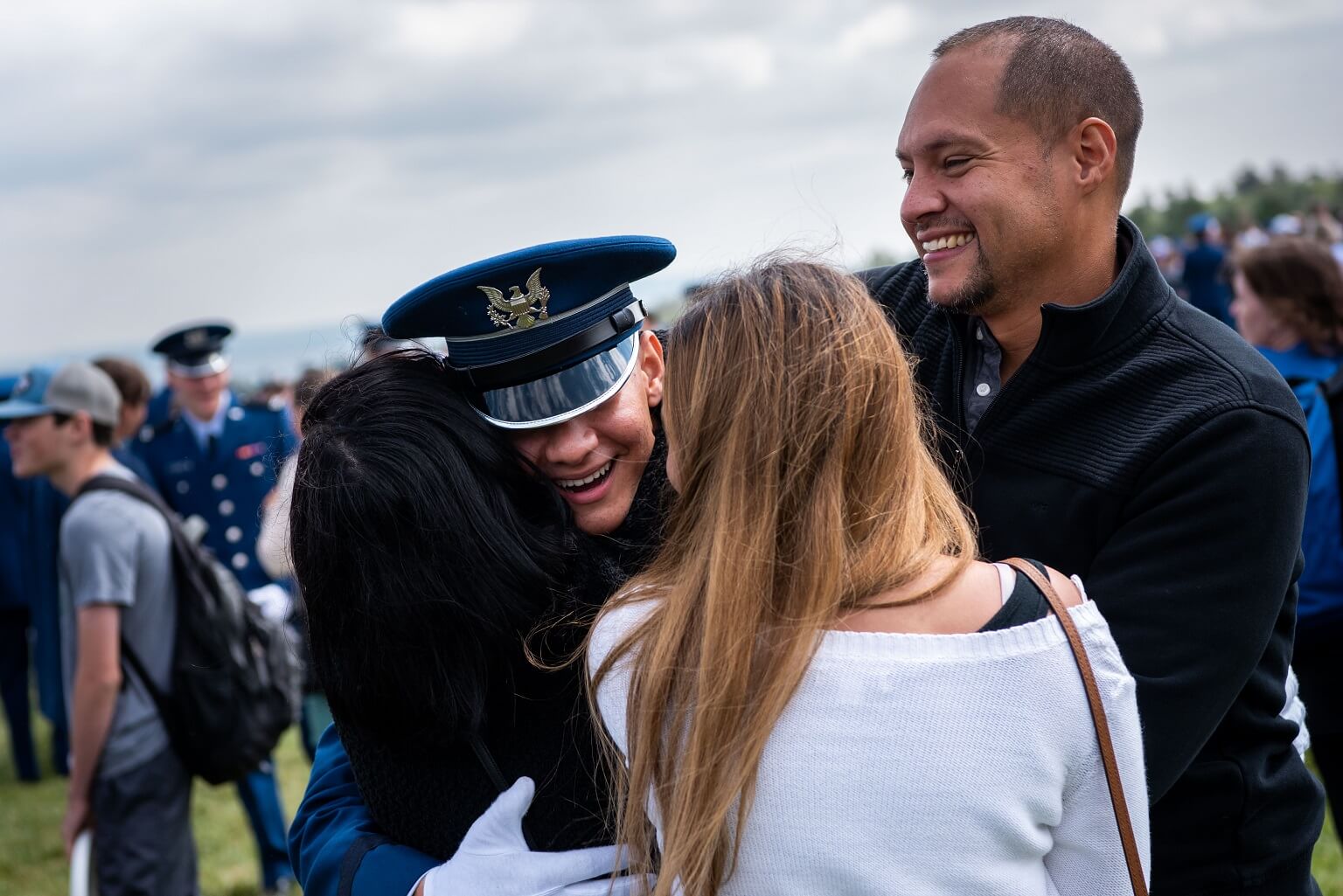 Cadet hugging parents