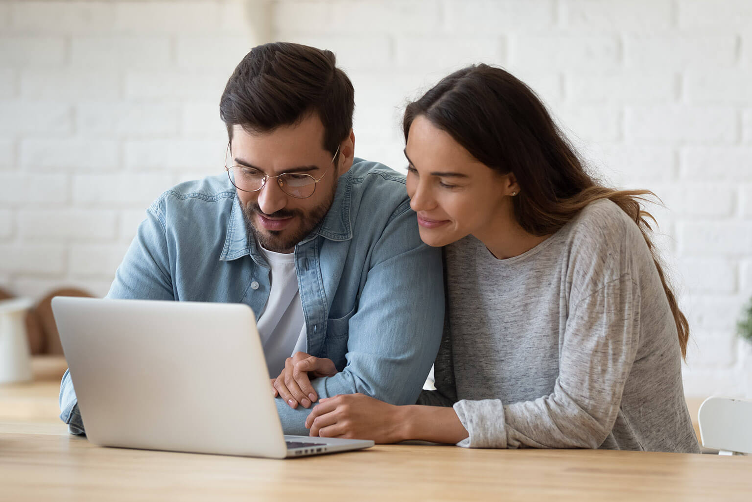 parents looking at laptop computer