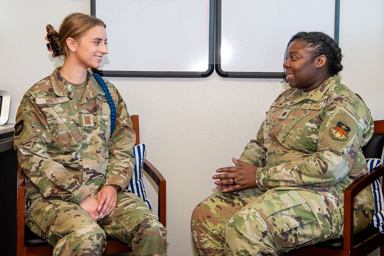 U.S. Air Force Academy Cadet 1st Class MacKenzie Marti speaks with Peak Performance Center Deputy Director Maj. (Dr.) Katrina Brown in the center’s office.