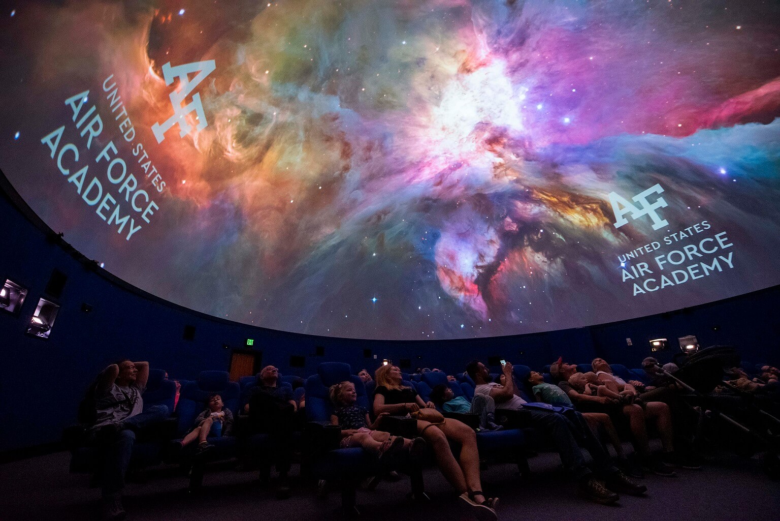 An audience gazes at the galaxy in the Planetarium’s hemispheric dome on May 7, 2022.