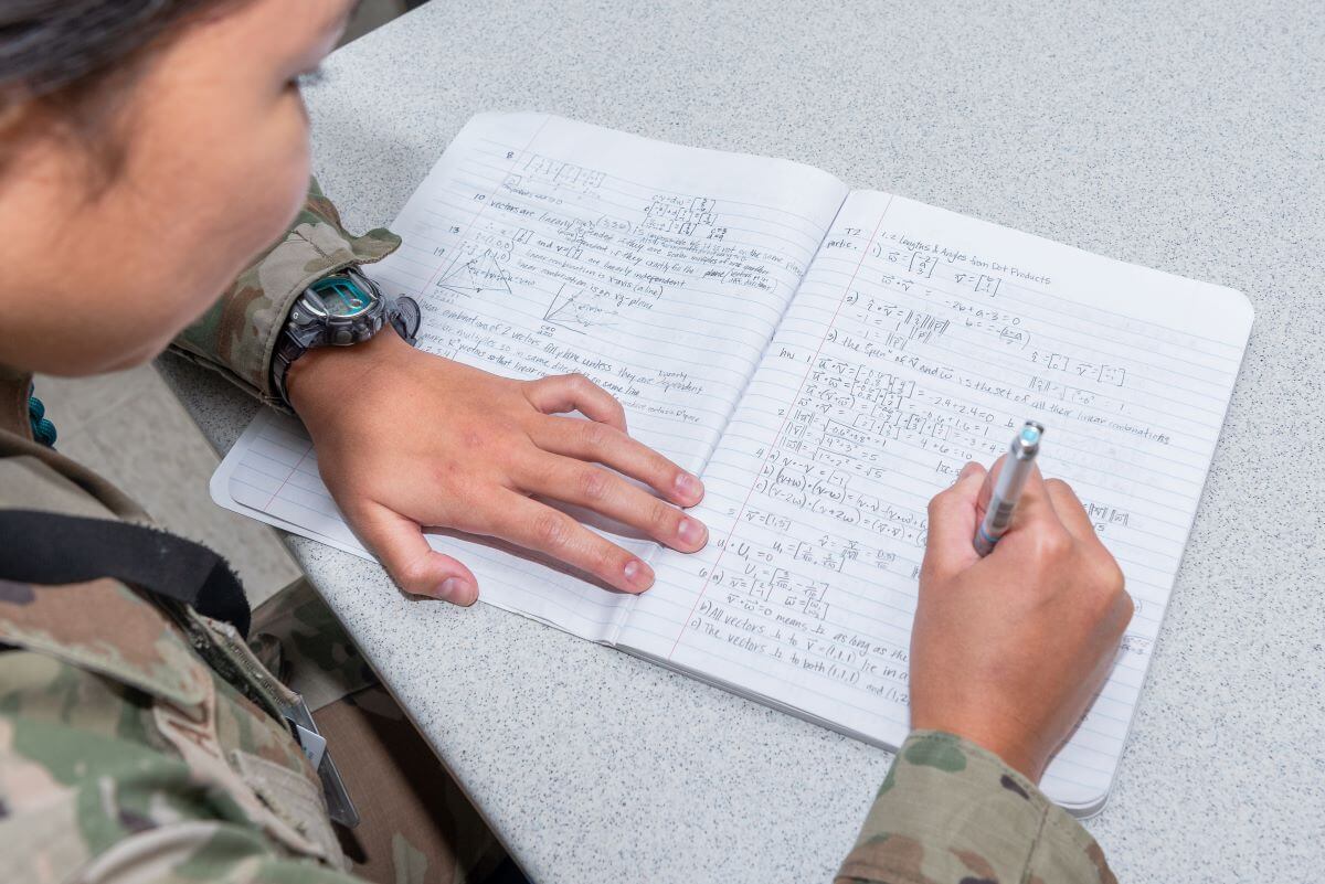 A cadet working through a difficult math problem.