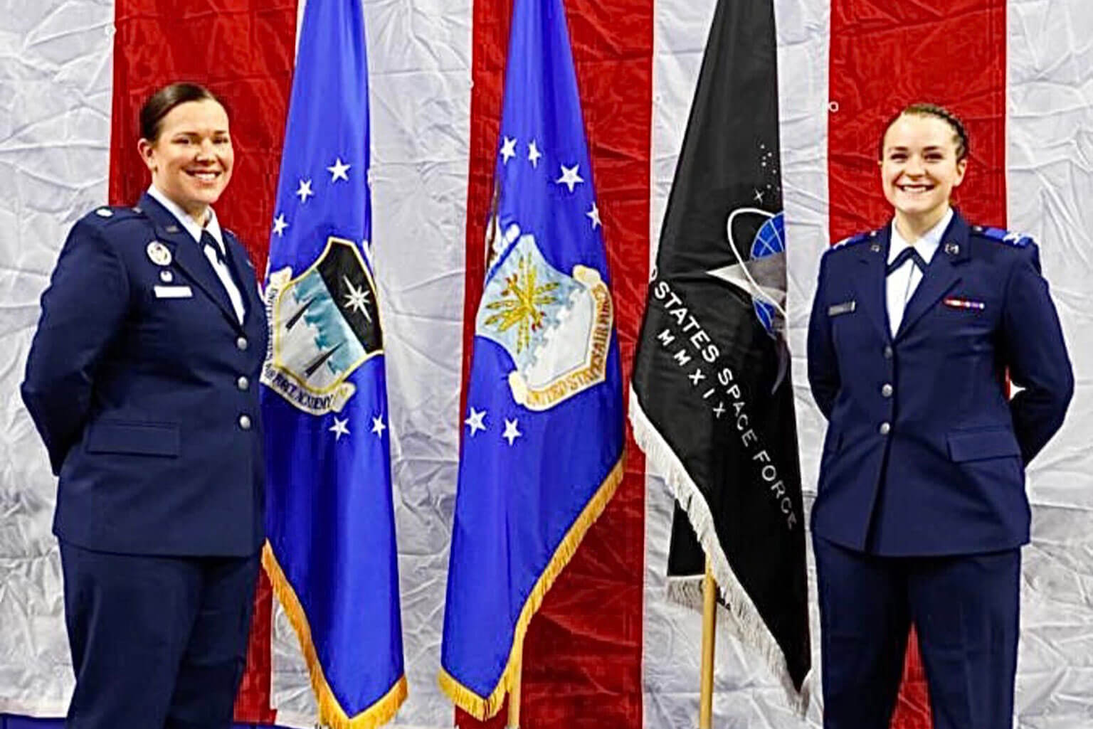 Lt. Col. Patricia Nadeau, Bravo Squadron Air Officer Commanding, U.S. Air Force Academy Preparatory School, poses for a photo with Cadet Candidate Billie Botes during the Preparatory School graduation at Clune Arena.
