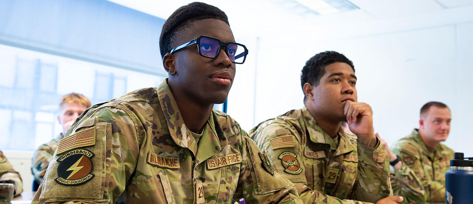 Image of cadet candidates working on a math problem.