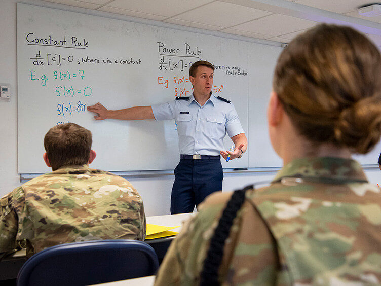 Image of Cadet Candidates working on a math problem.