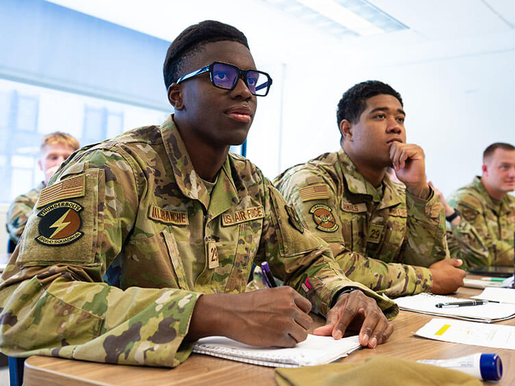 Image of Cadet Candidates working on a math problem.