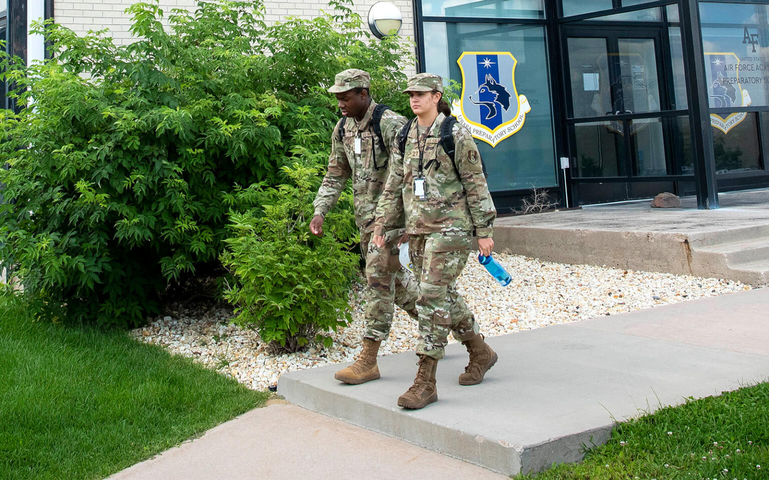 Image of cadet candidates walking between buildings.