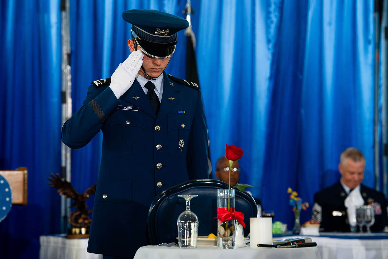Cadet 3rd Class Joseph Duran renders his salute at the POW/MIA Table during a formal dinner at Mitchell Hall.