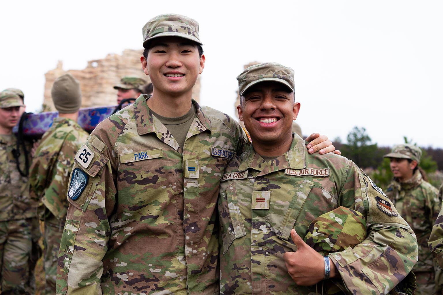 Cadets 1st Class Geun Hyung Park and Kenny Dela Cruz share a moment after completing the Run to the Rock during the U.S. Air Force Academy Recognition and Promotion weekend.