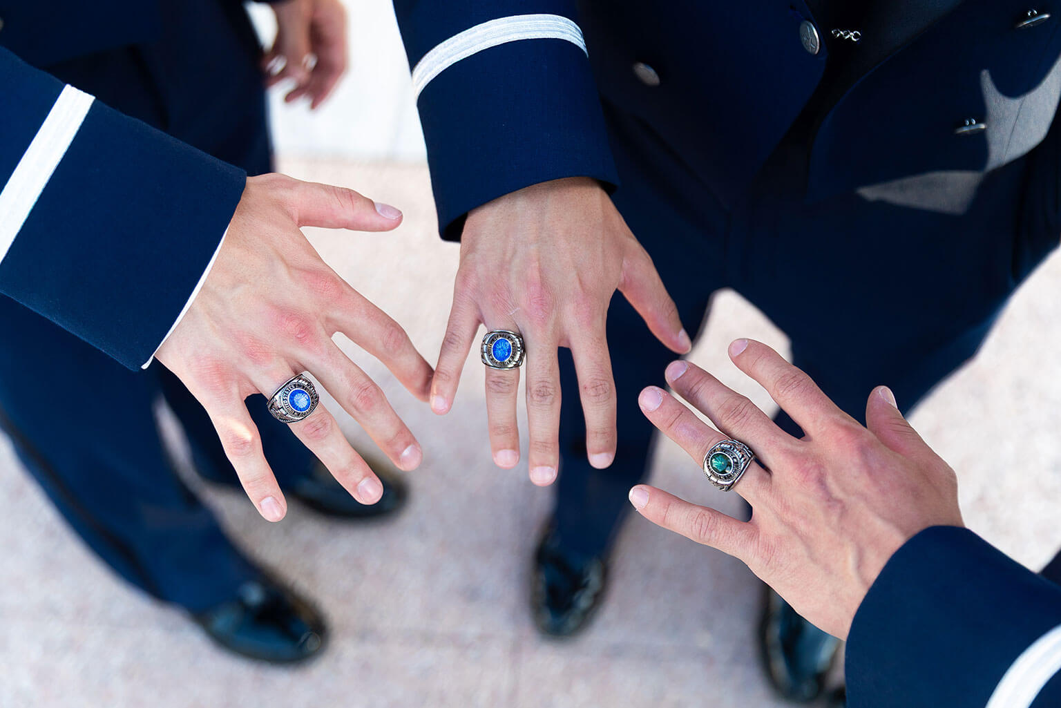 Cadets show off their rings at the Class of 2026 Ring Dance, at the U.S. Air Force Academy.