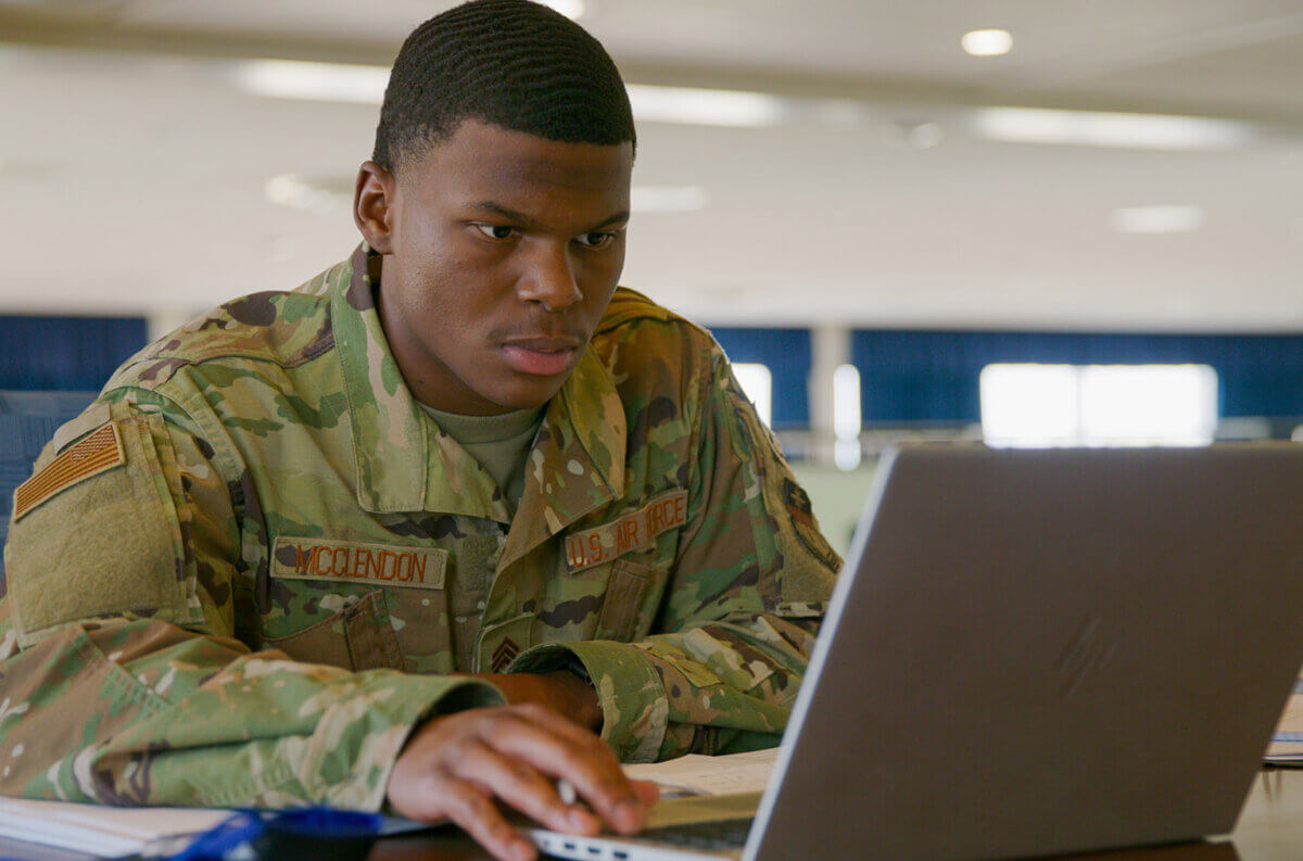Cadet at laptop computer.