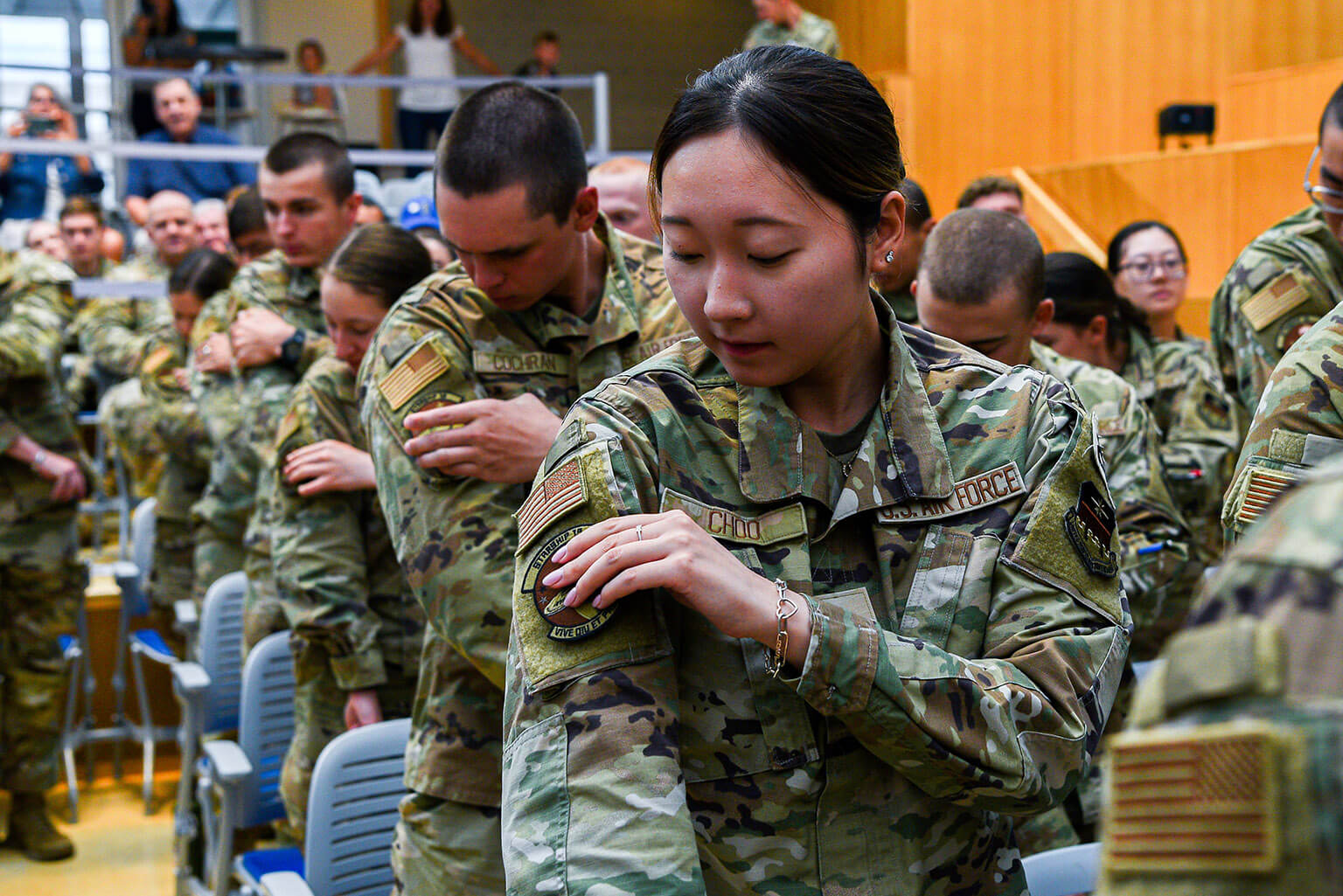 U.S. Air Force Academy Cadet 2nd Class Charlotte Choo puts on her new Cadet Squadron 19 patch