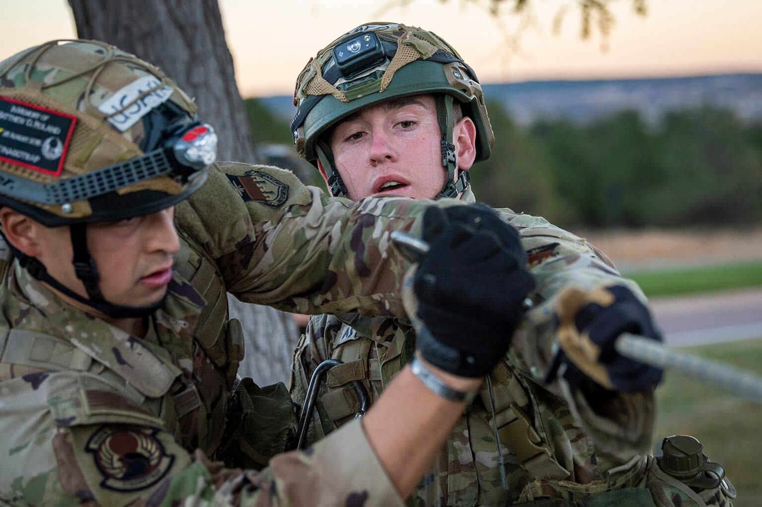 Cadets constructing a rope bridge