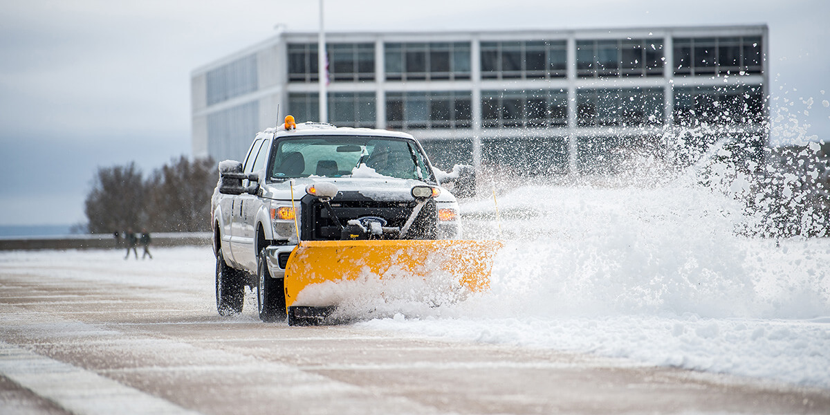 Image of a truck plowing snow on the Terrazzo.